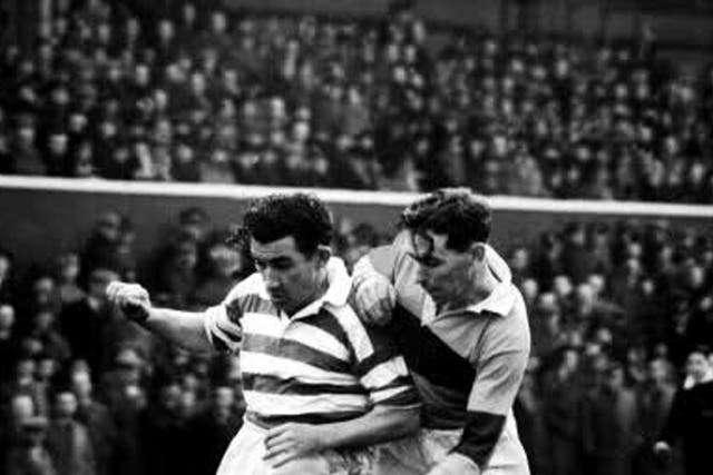 Andy Paton (right), whose father and three uncles had been professional footballers, was combative in the air and a fearless
tackler