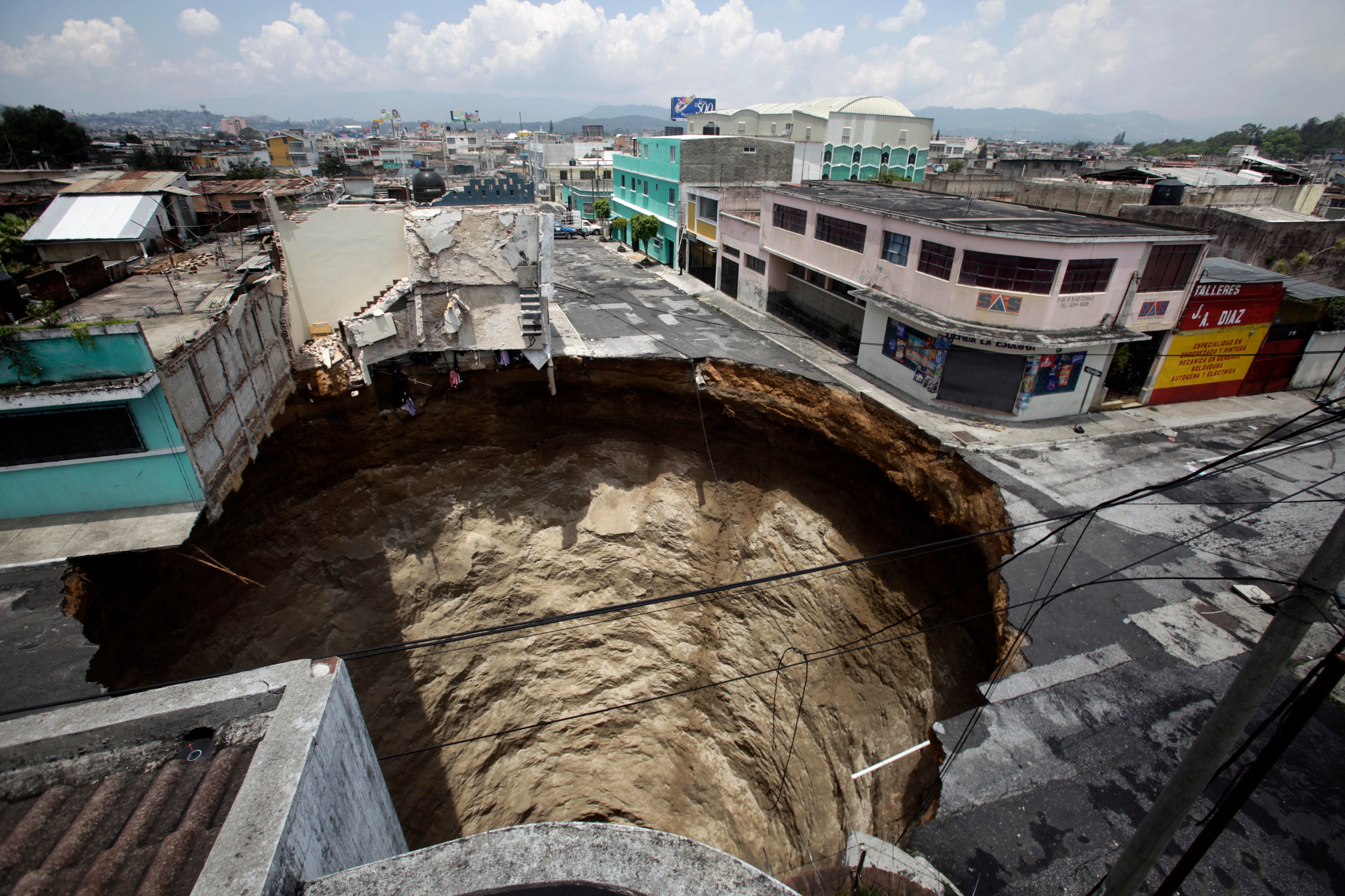 The sinkhole above opened up in Guatemala City in 2010, swallowing a three-storey building almost instantly.