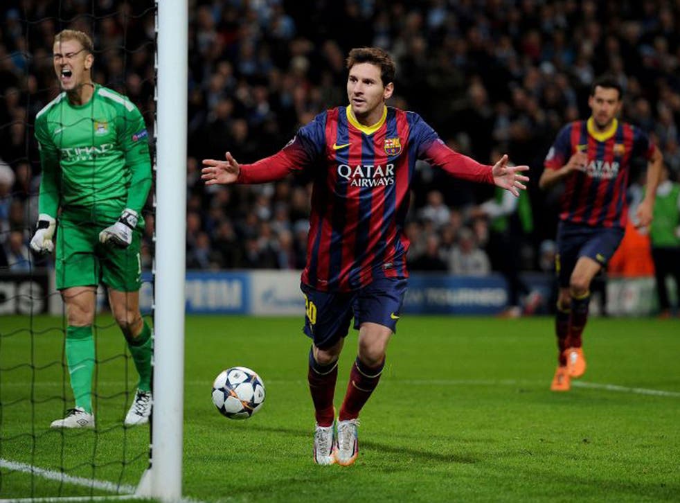 Lionel Messi celebrates scoring his team's goal past Manchester City's Joe Hart (left) from the penalty spot