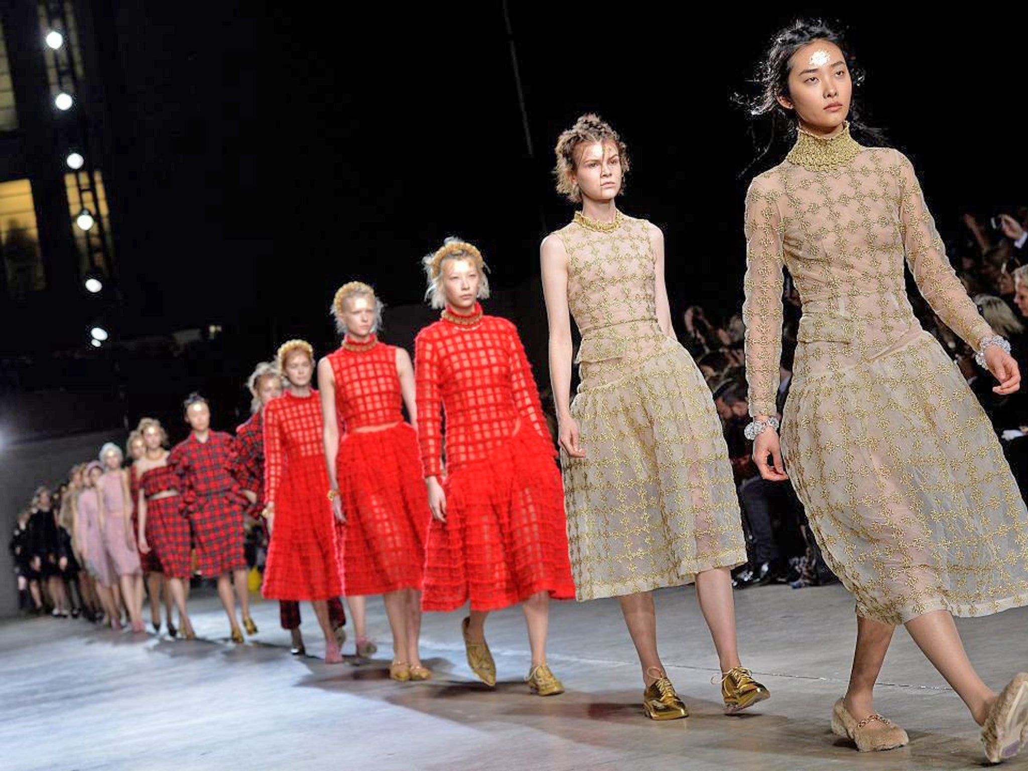 Models present creations from designer Simone Rocha during the 2014 Autumn / Winter London Fashion Week