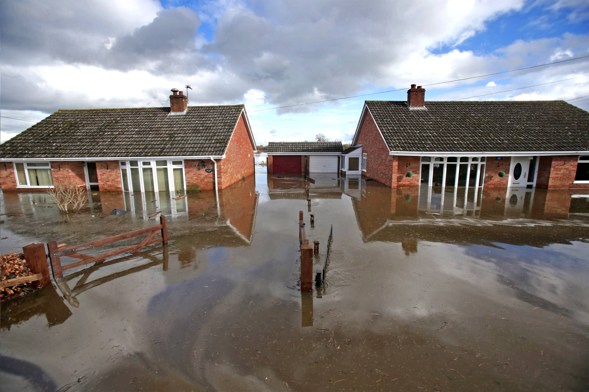 Flood water continues to surround properties in the largely evacuated village of Moorland on the Somerset Levels