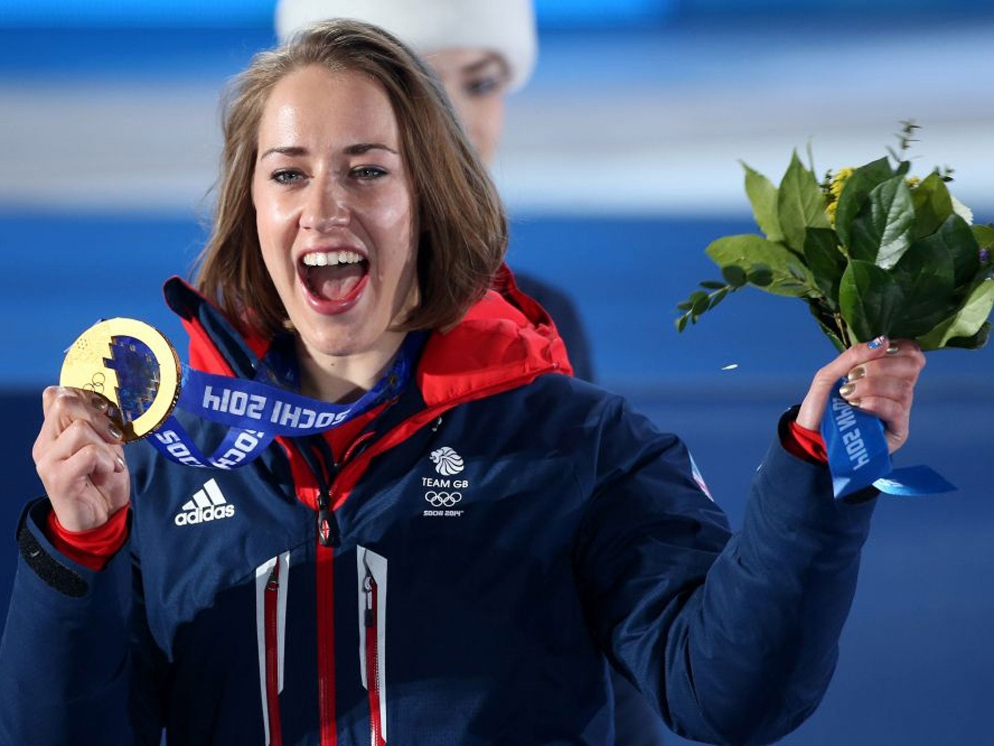 Lizzie Yarnold with the Gold medal she won in the Women's Skeleton, during the Medal Ceremony at the Medals Plaza, at the 2014 Sochi Olympic Games in Sochi, Russia.