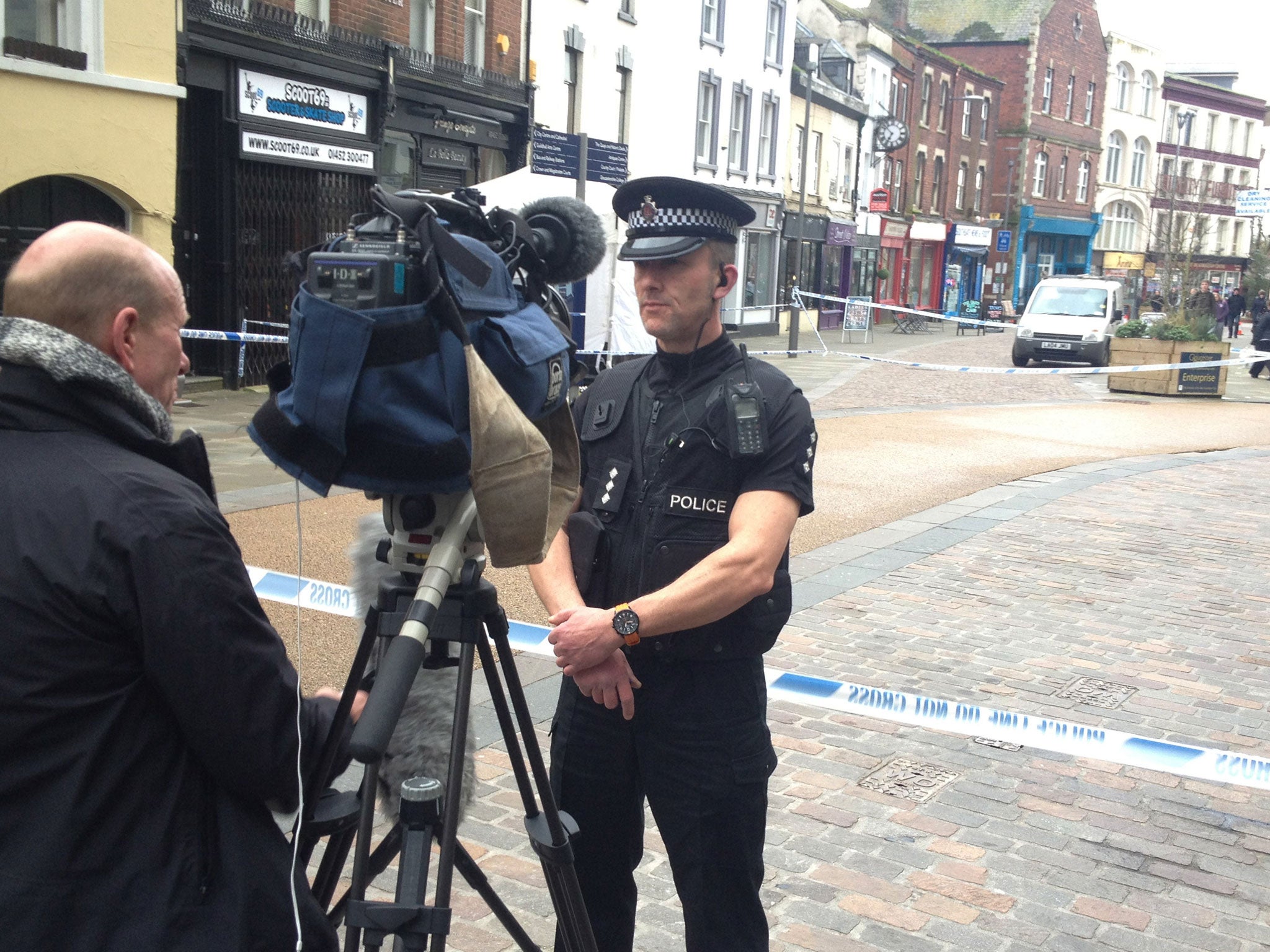 Chief Inspector Neil Smith of Gloucestershire Police speaks to media outside Fringe Benefits and La Bella Beauty on Southgate Street, Gloucester (PA)