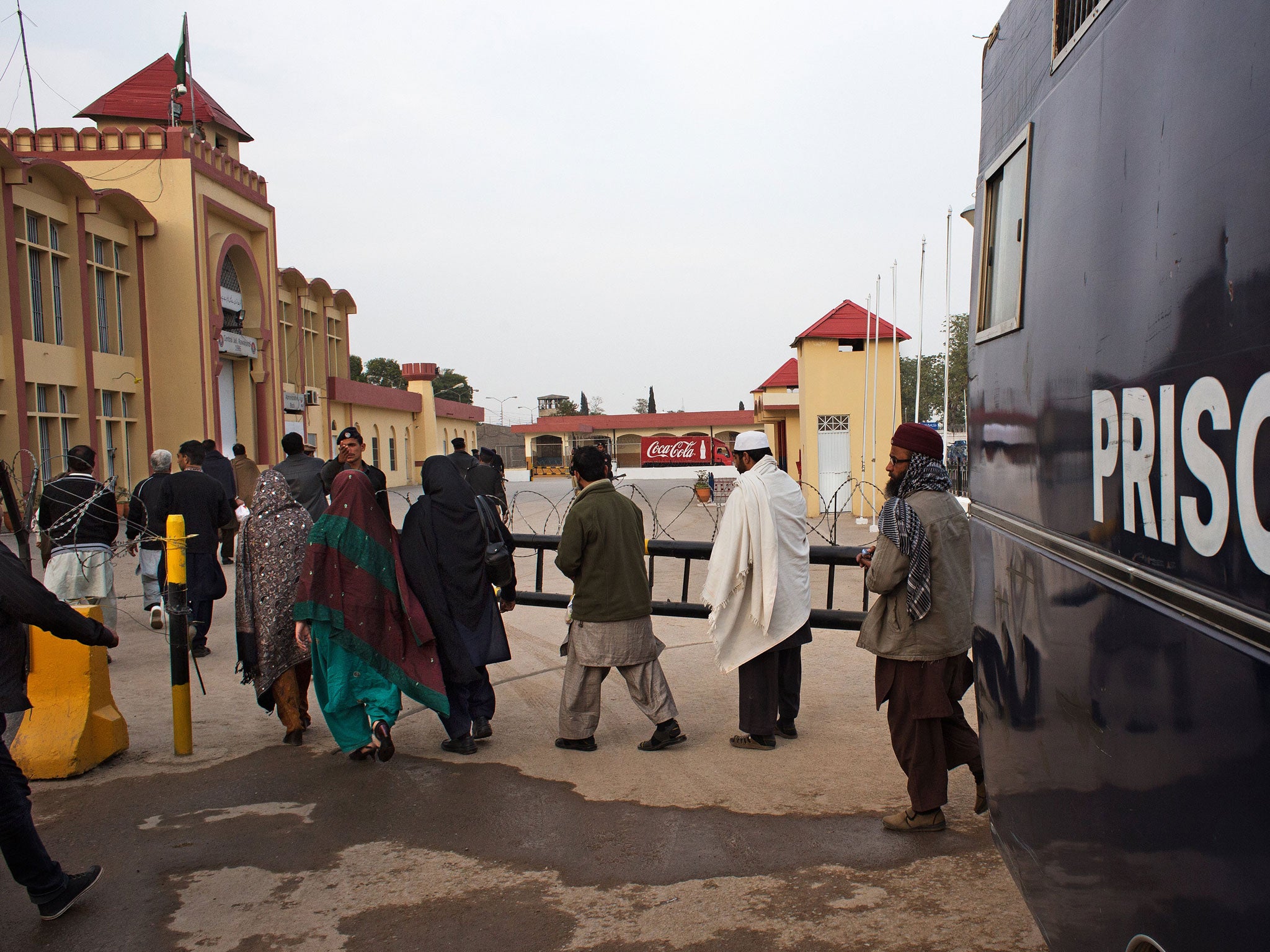 Prisoners are transferred from a van to the Rawalpindi central jail, where Mohmmad Asghar is being housed