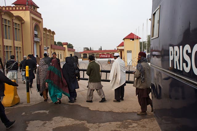 Prisoners are transferred from a van to the Rawalpindi central jail, where Mohmmad Asghar is being housed