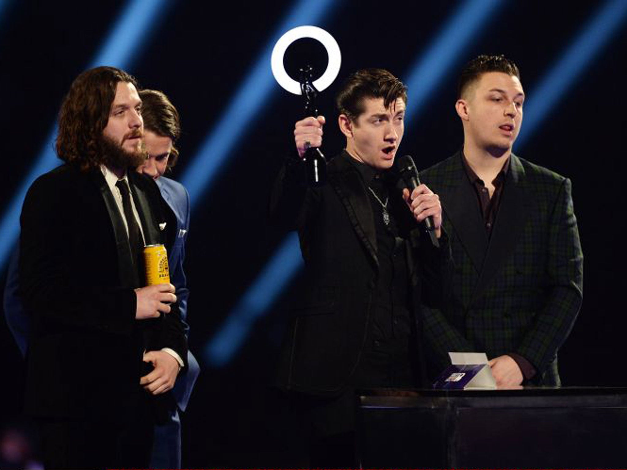 Arctic Monkeys with their award for Best British Group. The band also won Best Album