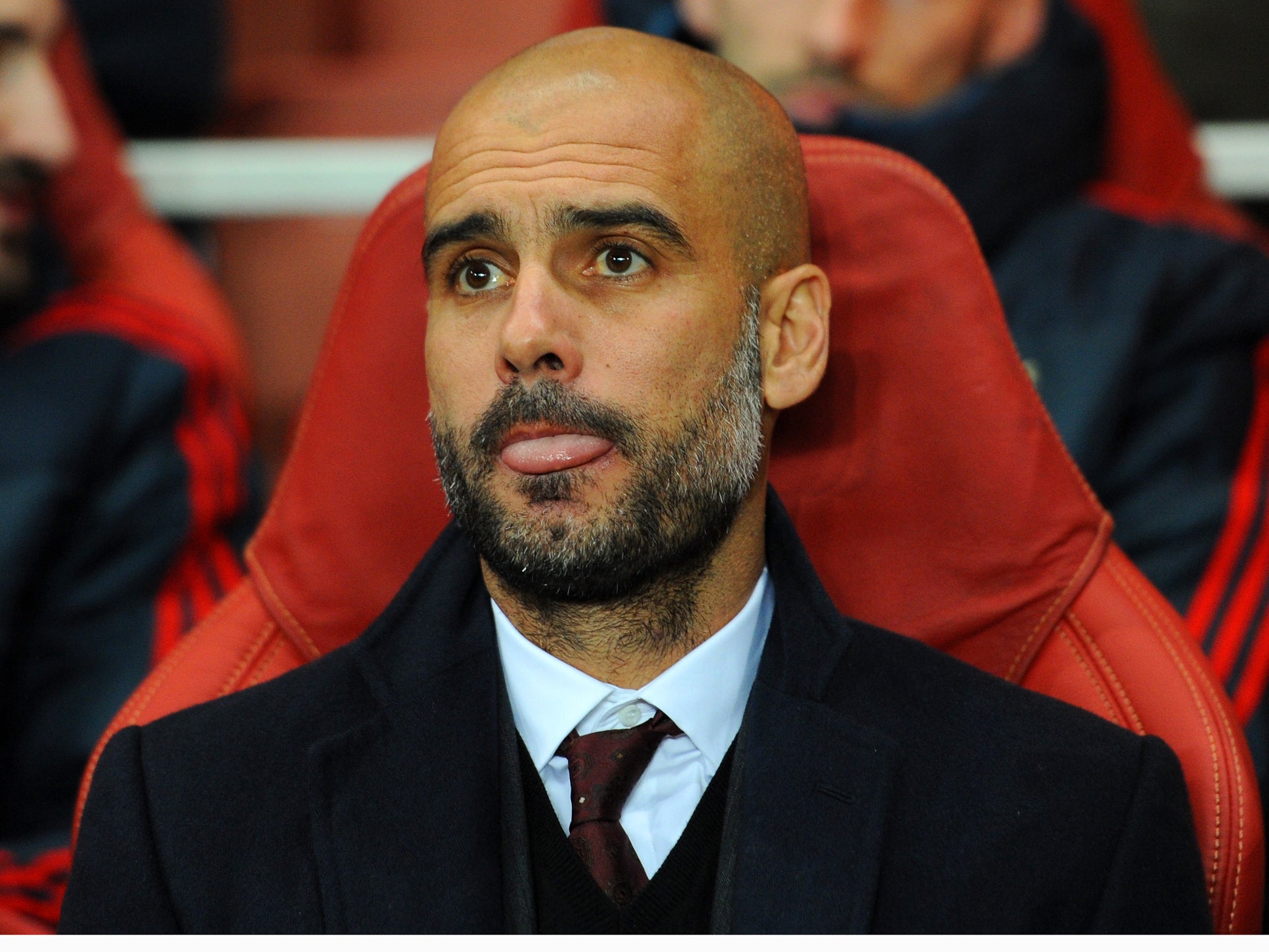 Bayern Munich coach Pep Guardiola looks on from the dugout
