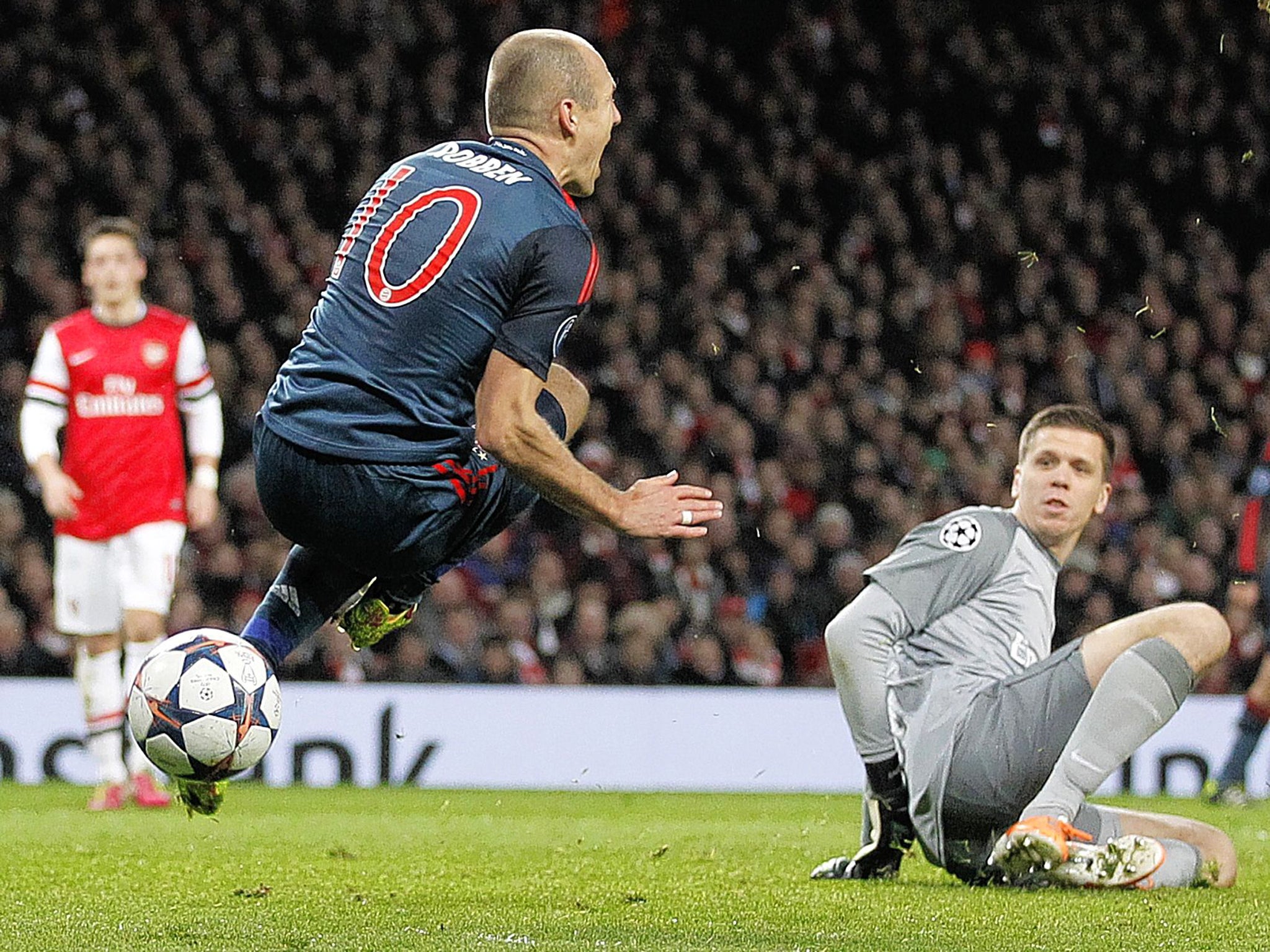Arjen Robben is brought down by Wojciech Szczesny during Bayern Munich's 2-0 victory over Arsenal