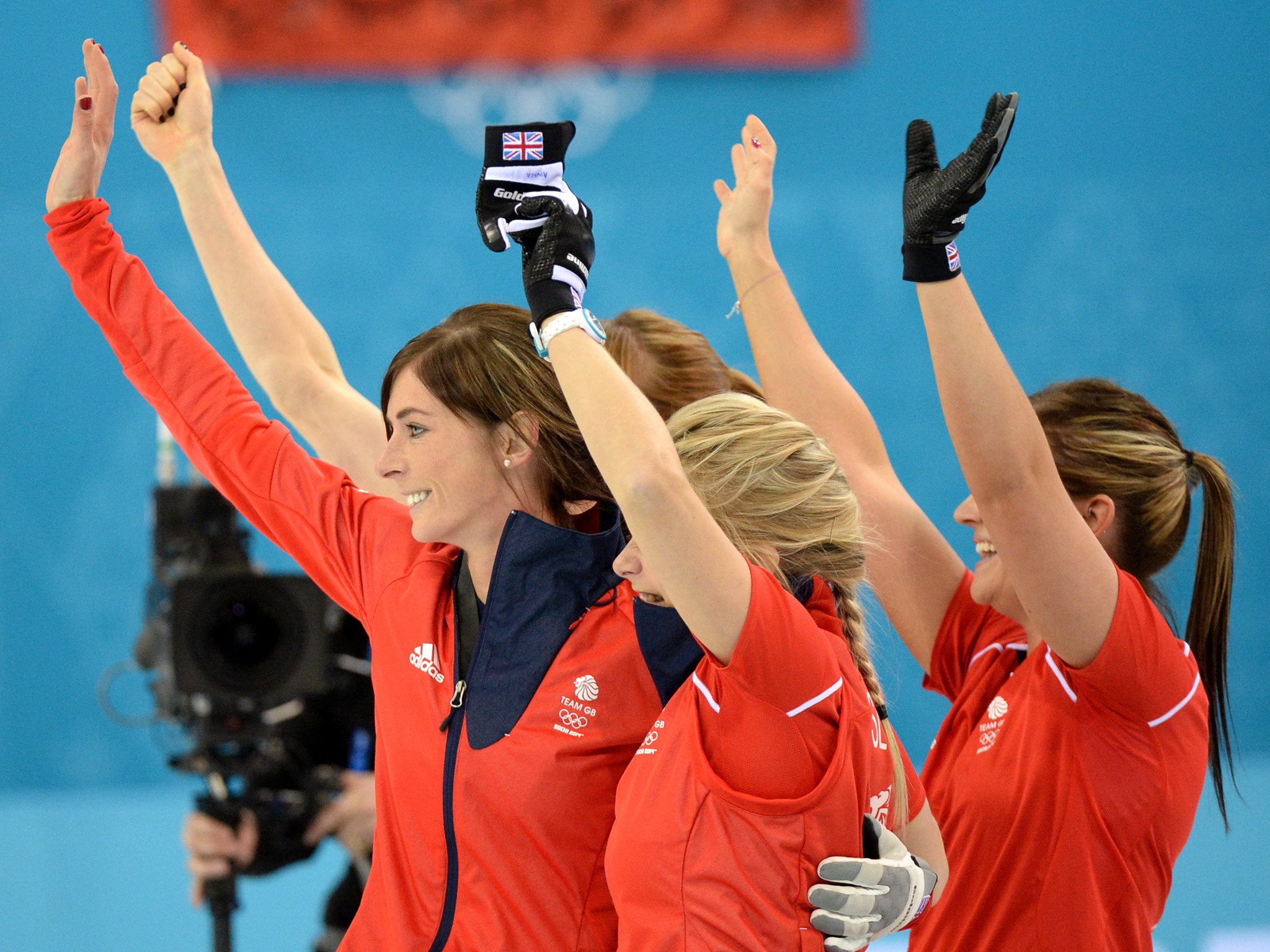 Great Britain's Anna Sloan, Eve Muirhead, Vicki Adams and Claire Hamilton celebrate after winning the Women's Curling Bronze Medal Game at the Ice Cube Curling Center