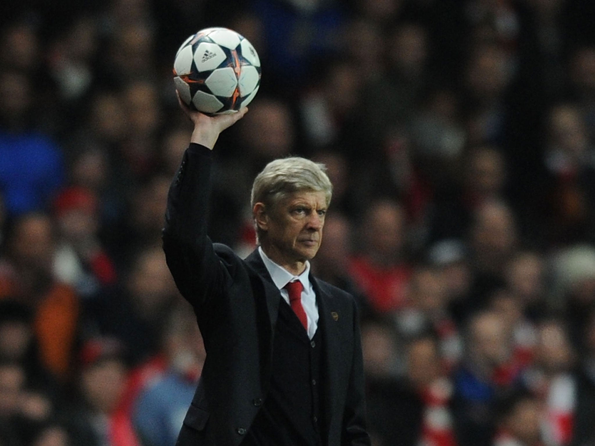 Arsene Wenger throws the ball back into play during Arsenal's 2-0 defeat against Bayern Munich on Wednesday night