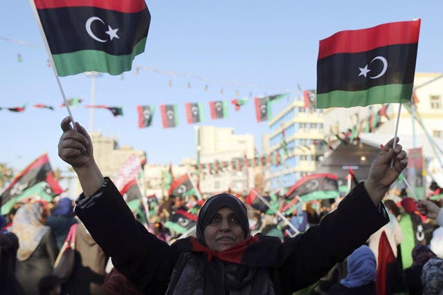 Libyans celebrate the third anniversary of the uprising against Muammar Gaddafi at Freedom Square in Benghazi