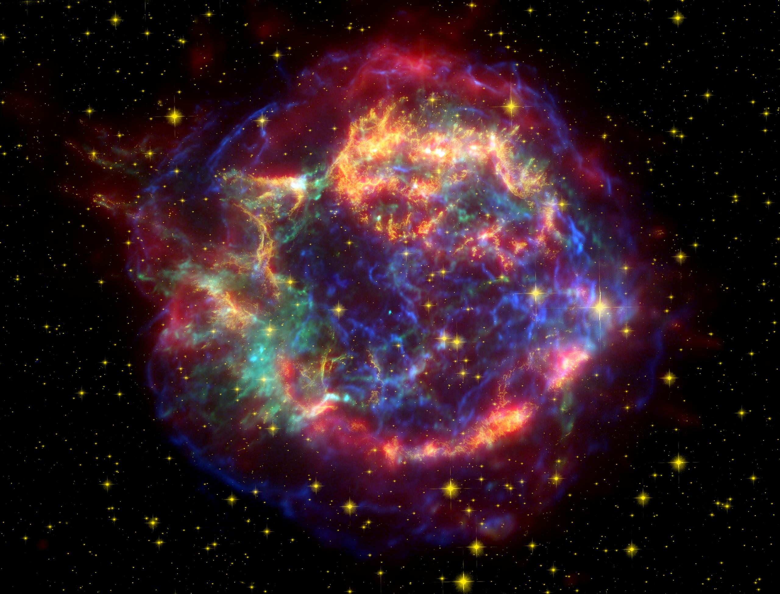 A false colour image of Cassiopeia A creating using data from the Spitzer and Hubble Space Telescopes and the Chandra X-Ray observatory.