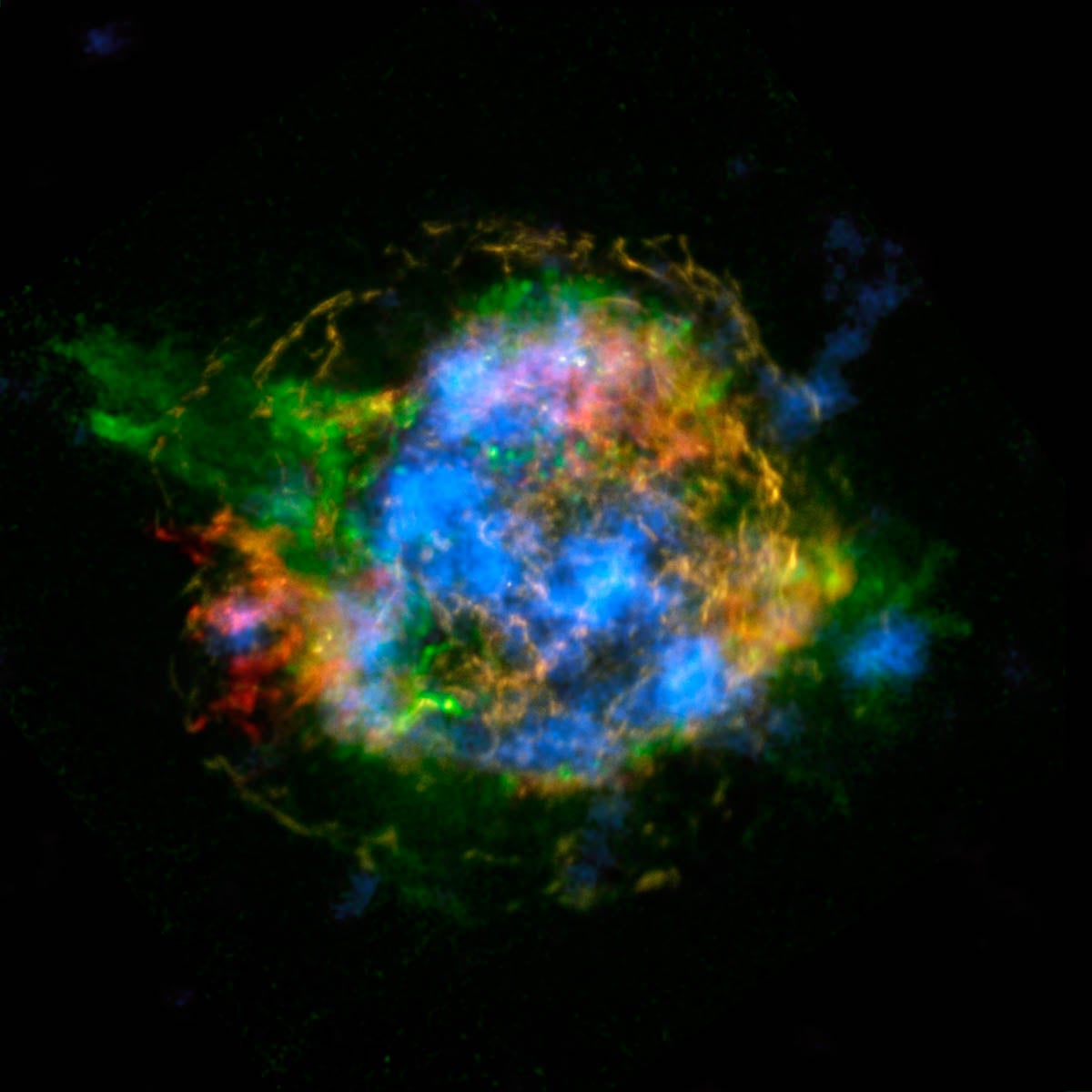 Superimposed images of the Cas A supernova remnant taken by NASA’s Chandra and NuSTAR orbiting telescopes. Red and green patches are iron and silicon/magnesium, respectively, while blue shows the distribution of titanium.