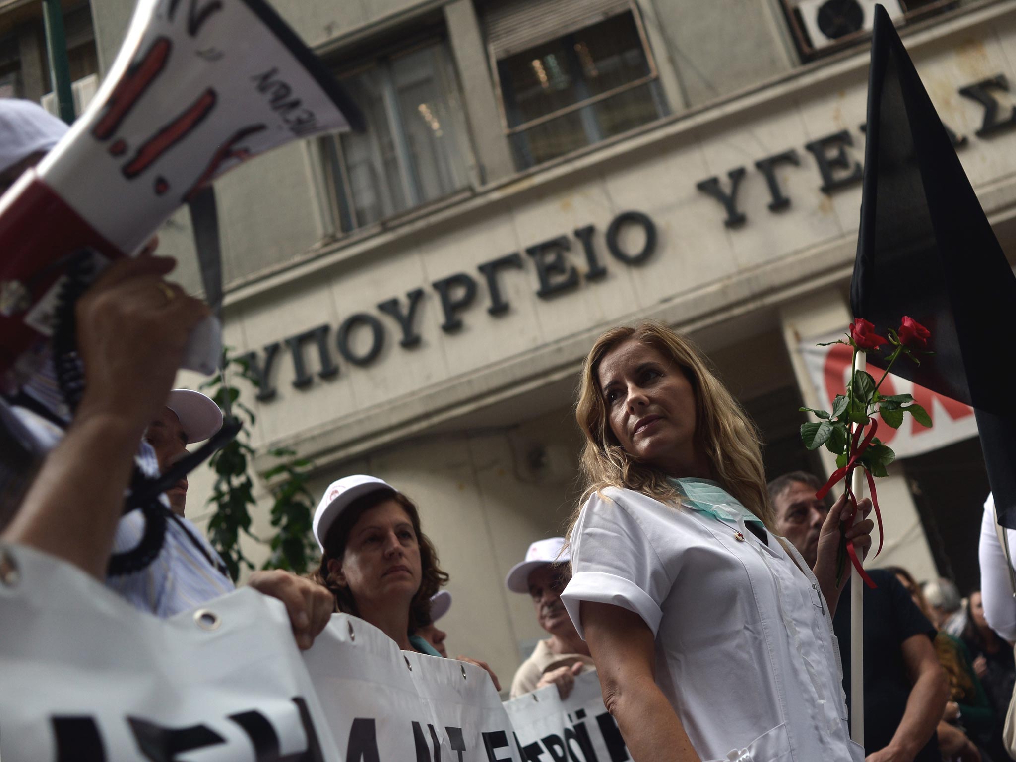 Health employees demonstrate outside the Health Ministry in Athens