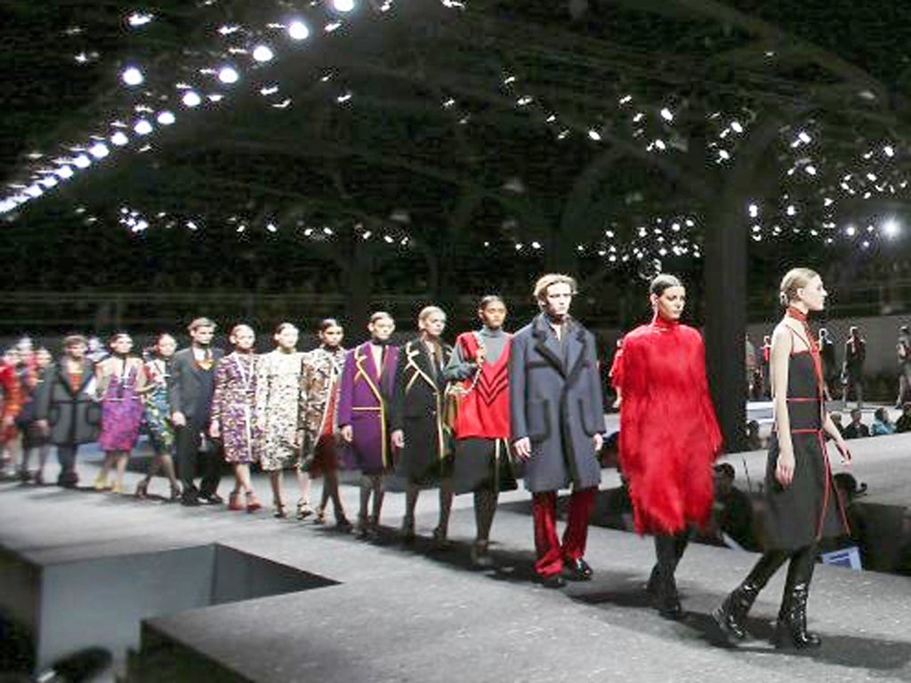 Models wear creations for Prada women's Autumn-Winter 2014-15 collection