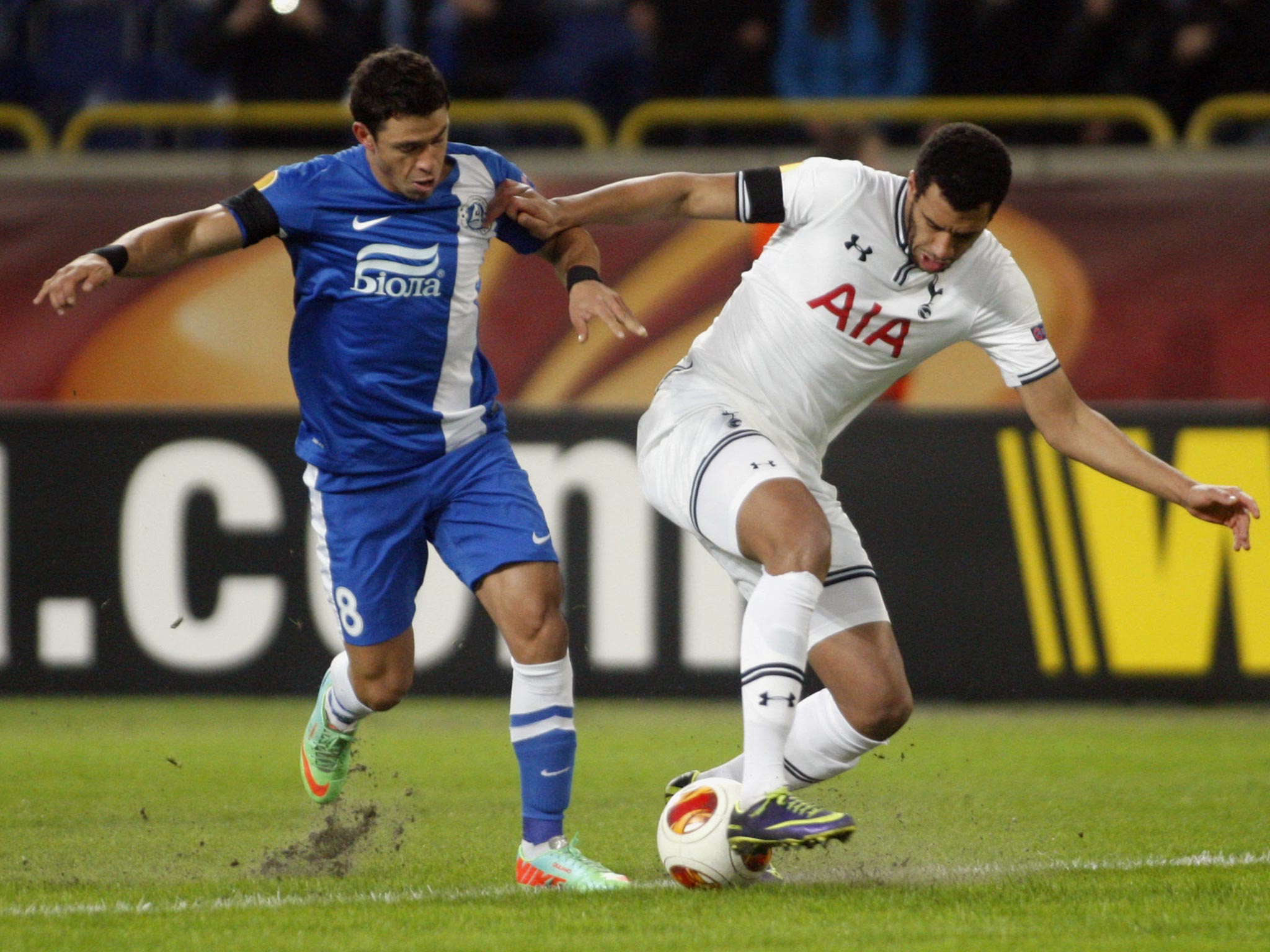 Dnipro's Victor Giuliano (left) vies with Tottenham Hotspur's Etienne Capoue,
