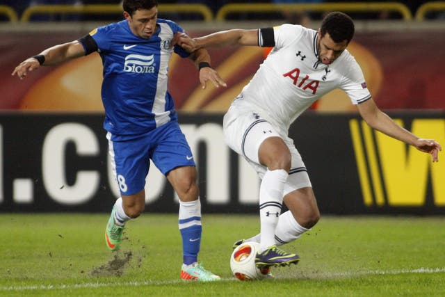 Dnipro's Victor Giuliano (left) vies with Tottenham Hotspur's Etienne Capoue, 