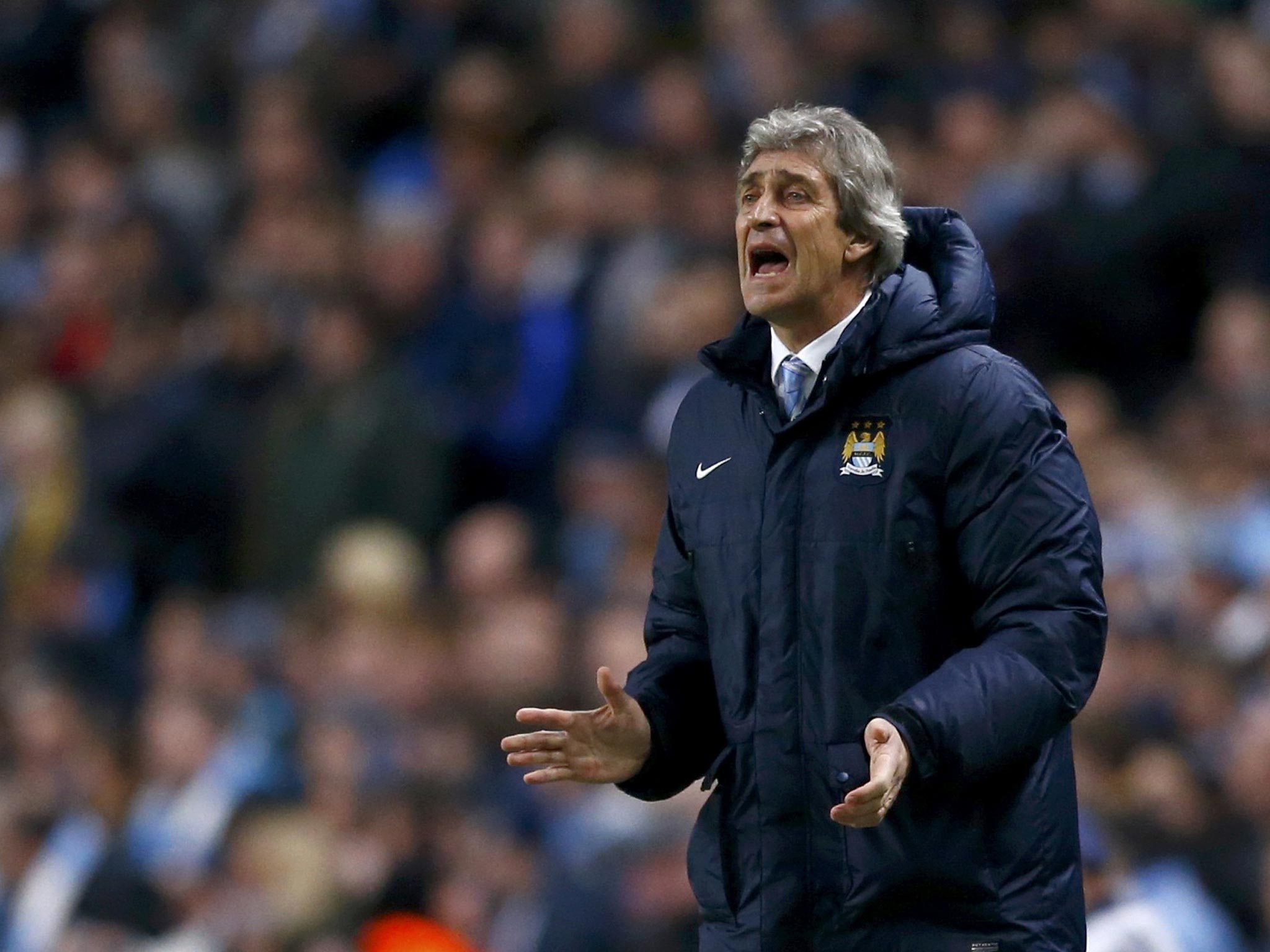 Manuel Pellegrini make a gesture from the touchline