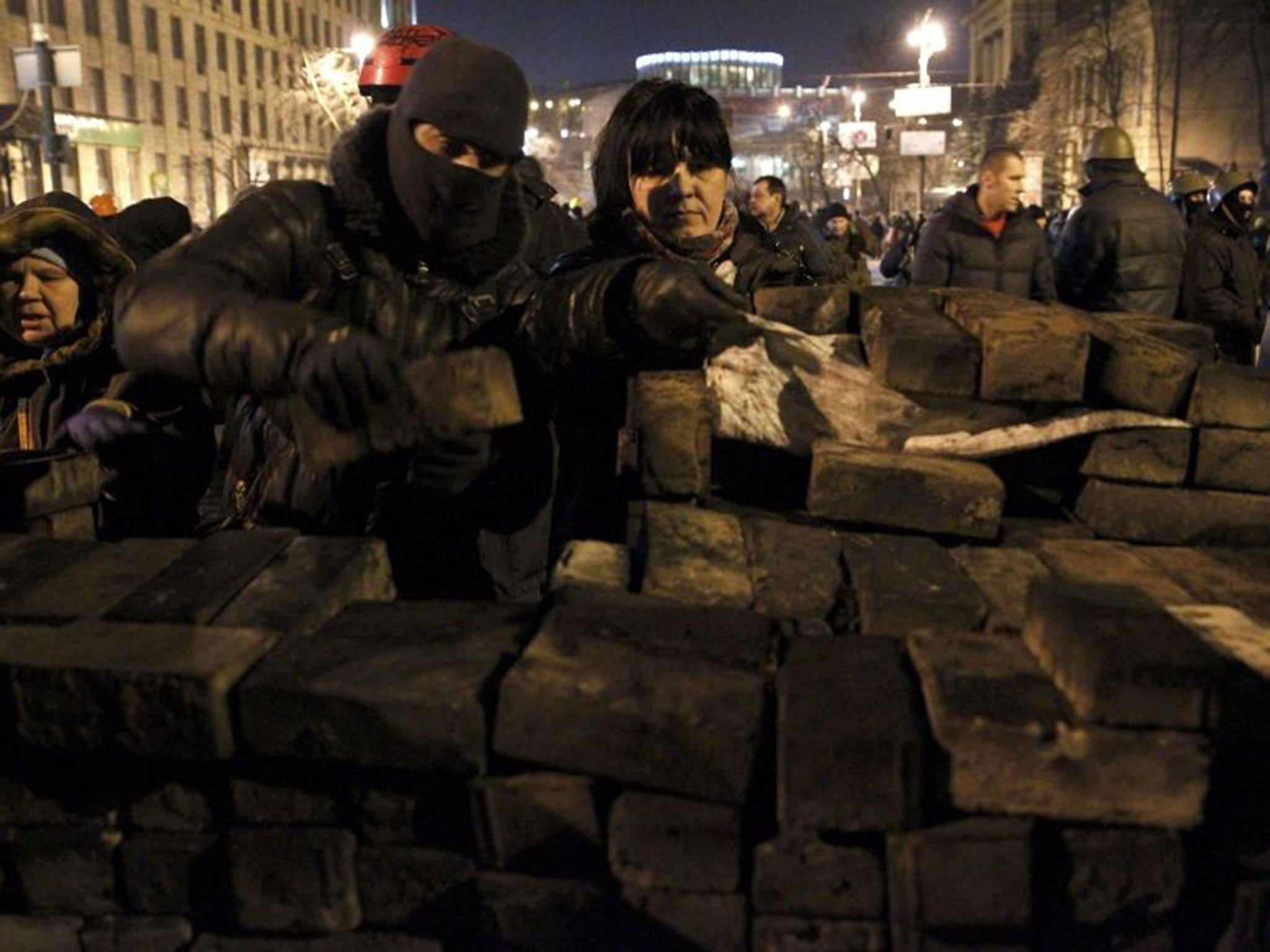 Opposition protesters build barricades overnight