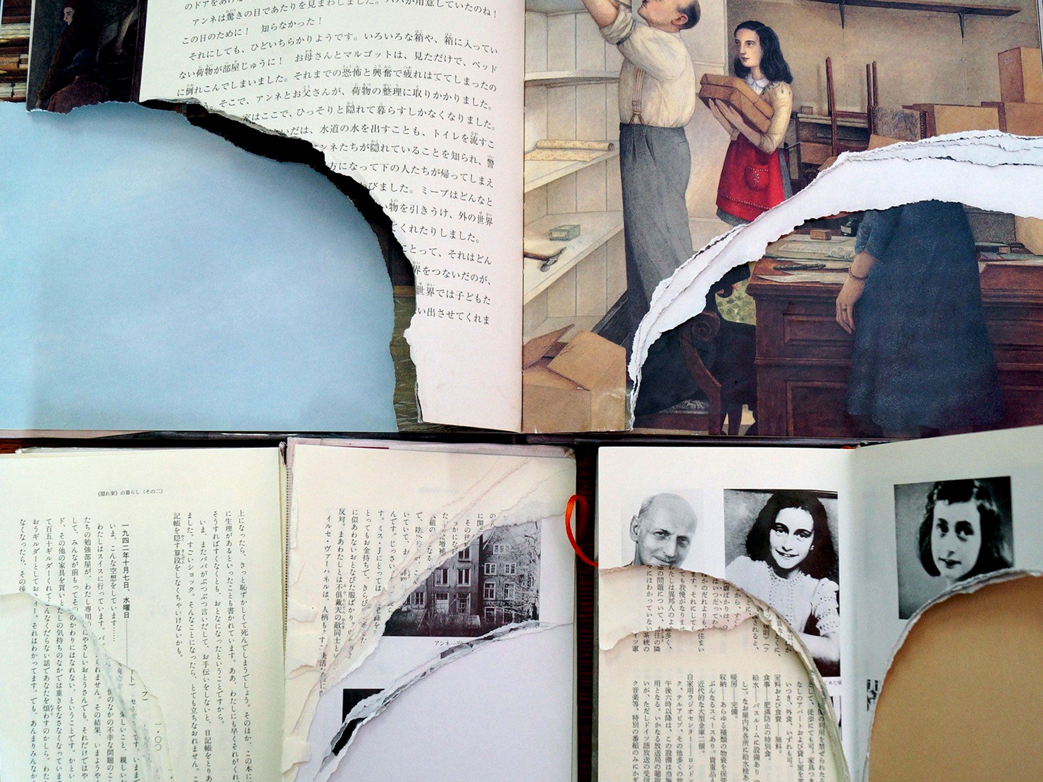 Ripped pages of three books of Anne Frank's 'Diary of Young Girl' are displayed at a library in Tokyo.