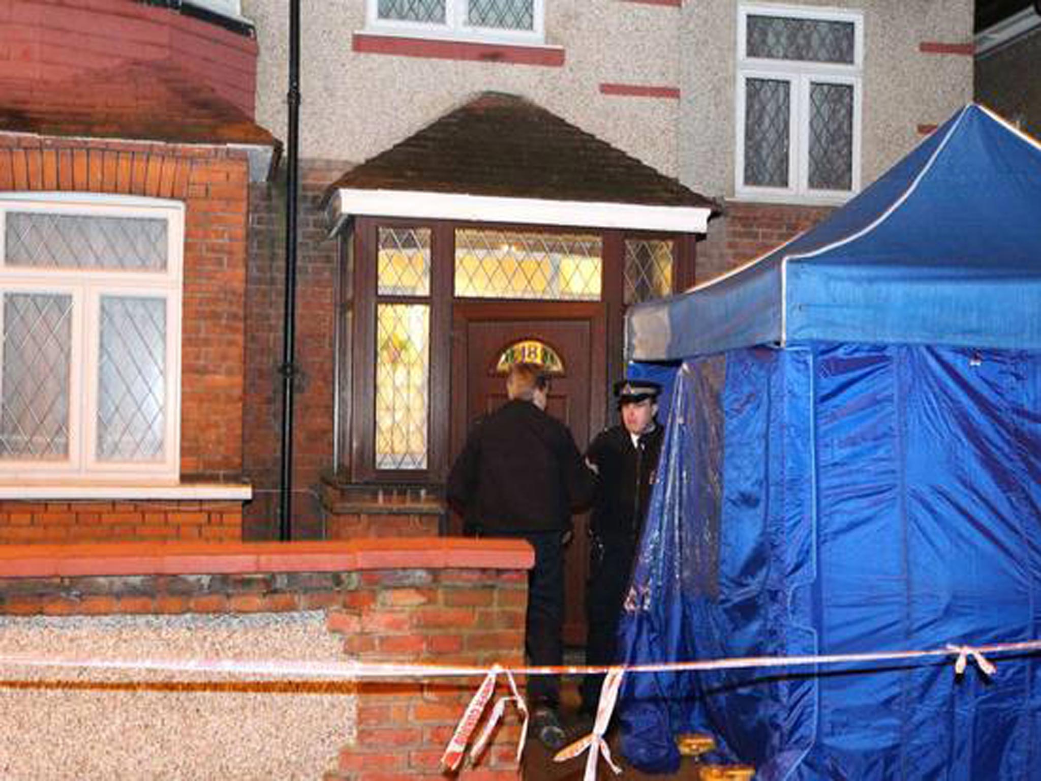 The police team outside the property in Hanwell