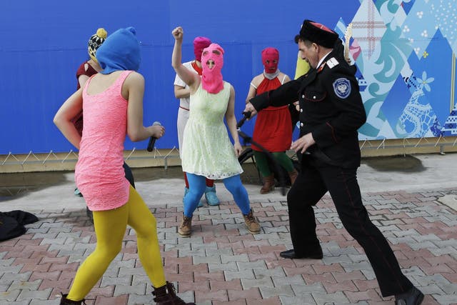 Members of the punk group Pussy Riot are attacked with whips in Sochi on Wednesday