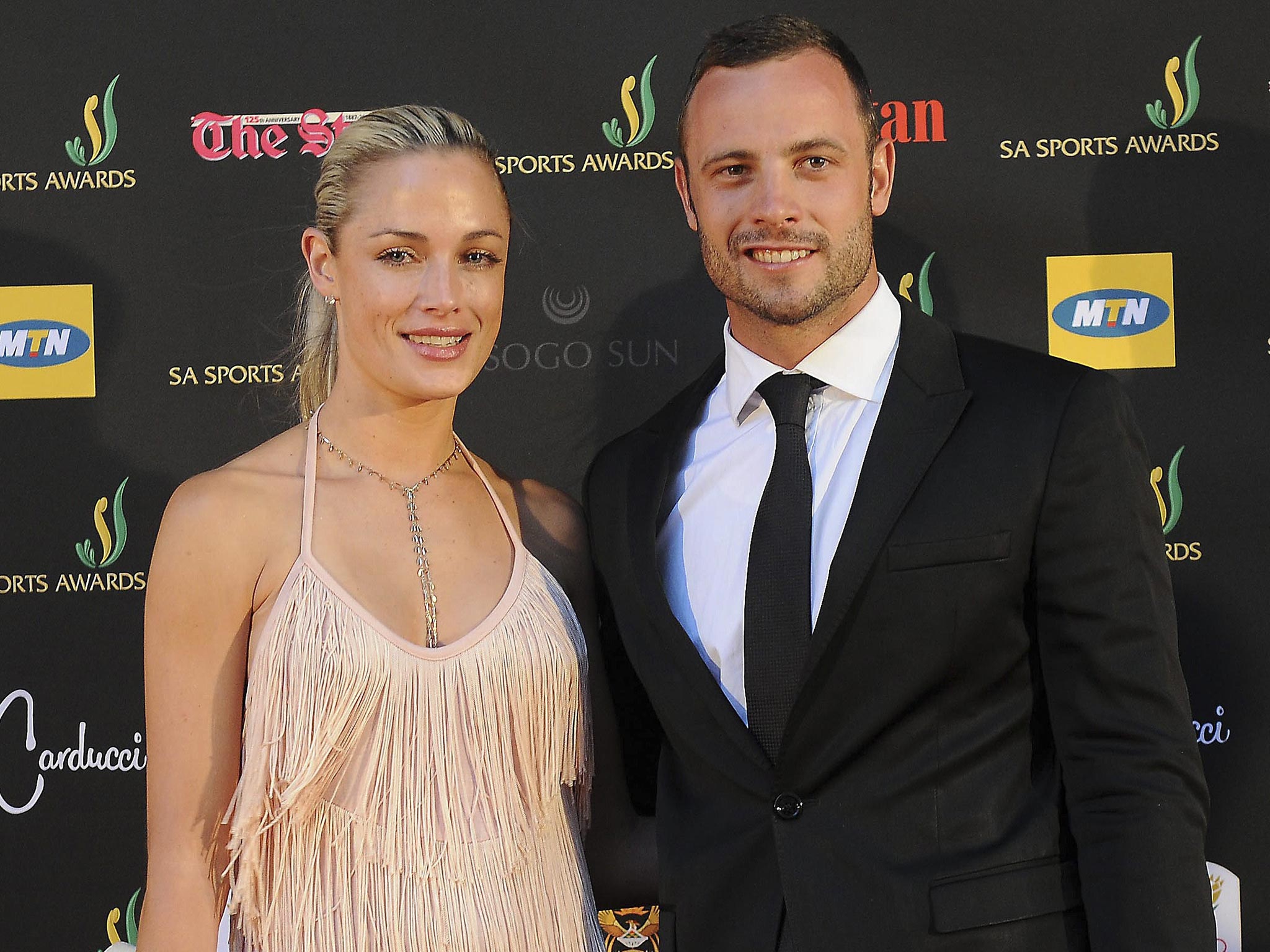 South African paralympic and Olympic sprinter Oscar Pistorius with his girlfriend and model Reeva Steenkamp