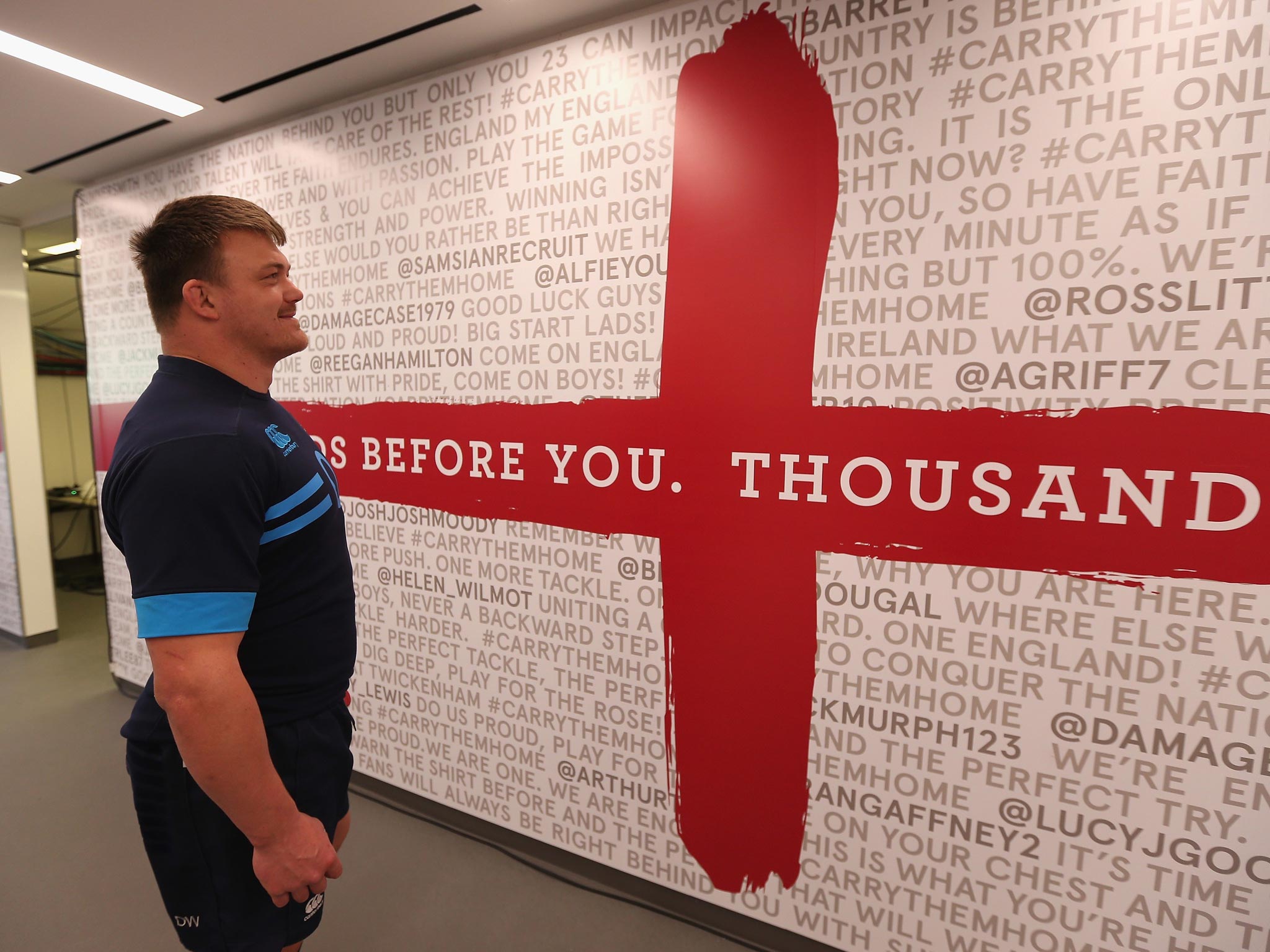 David Wilson reads tweets of support on the tunnel wall at Twickenham yesterday
