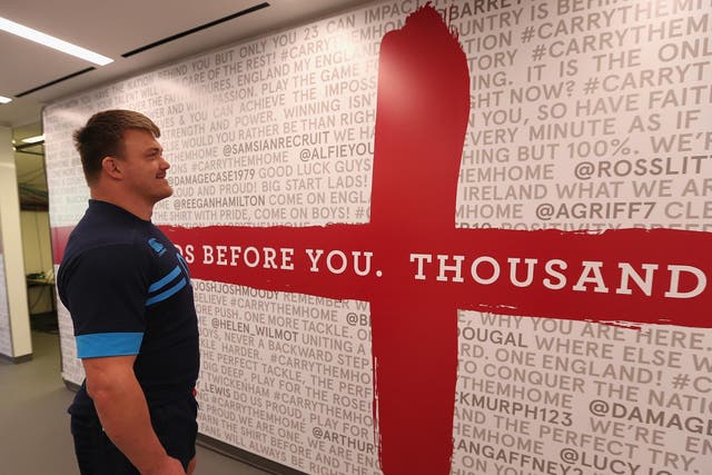 David Wilson reads tweets of support on the tunnel wall at Twickenham yesterday