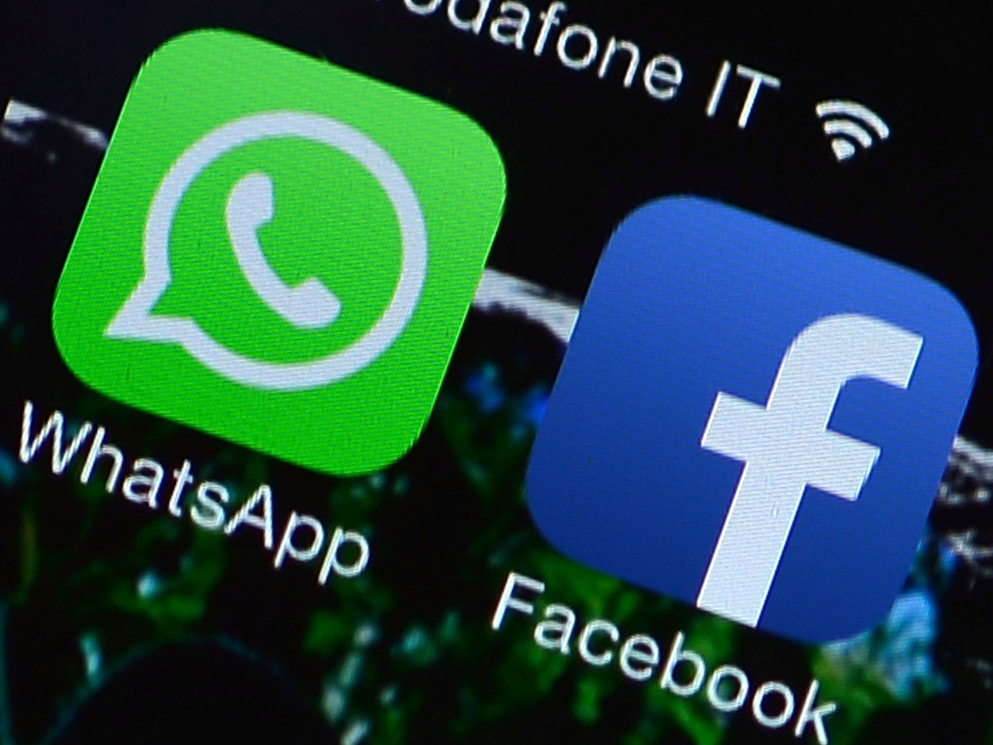The Facebook and WhatsApp applications' icons are displayed on a smartphone. Whatsapp cut out on Saturday 22 February, days after Facebook bought the app.