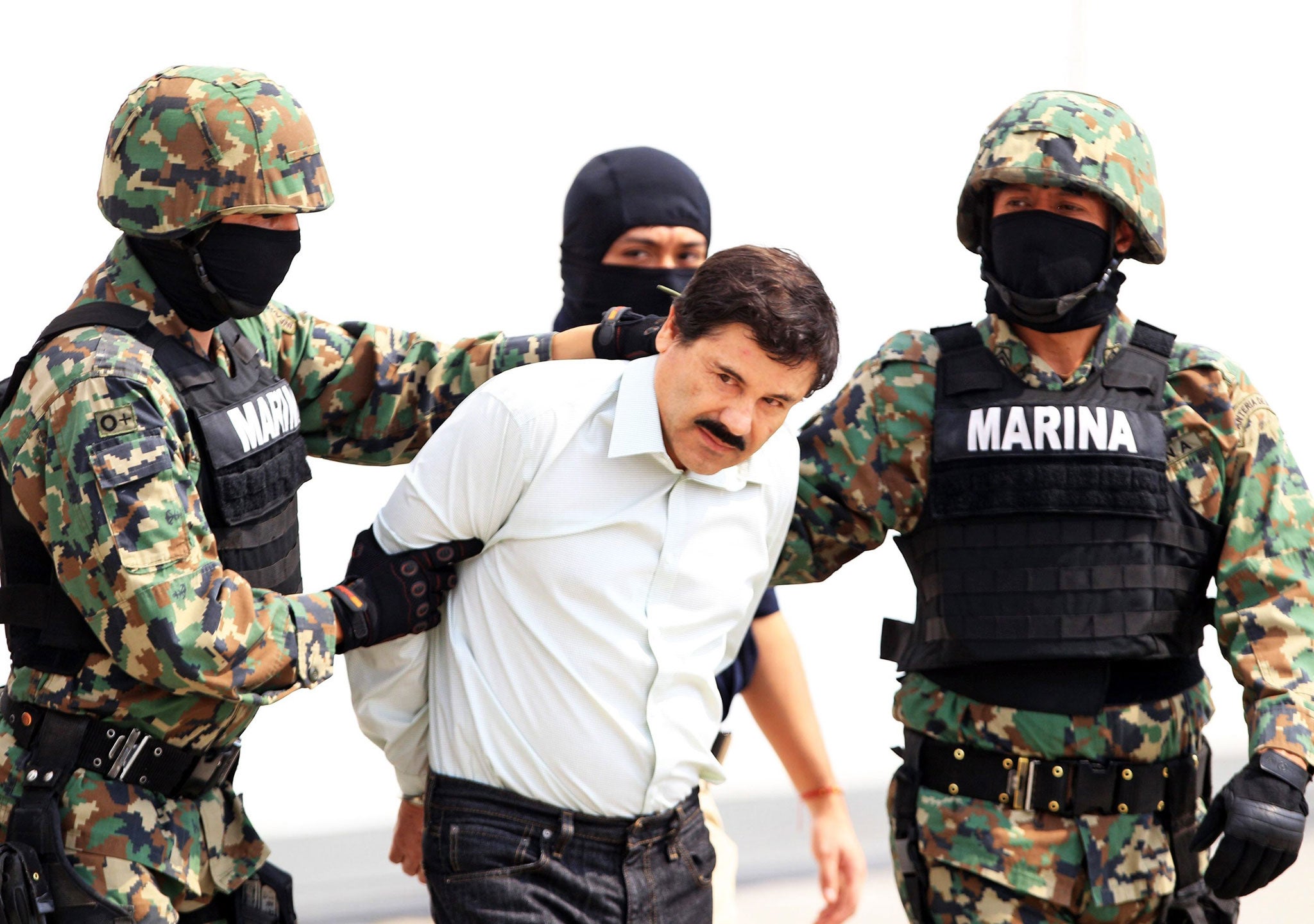 Mexican military hold drug lord Joaquin Guzman, also known as 'El Chapo' in Mexico City, 22 February 2014