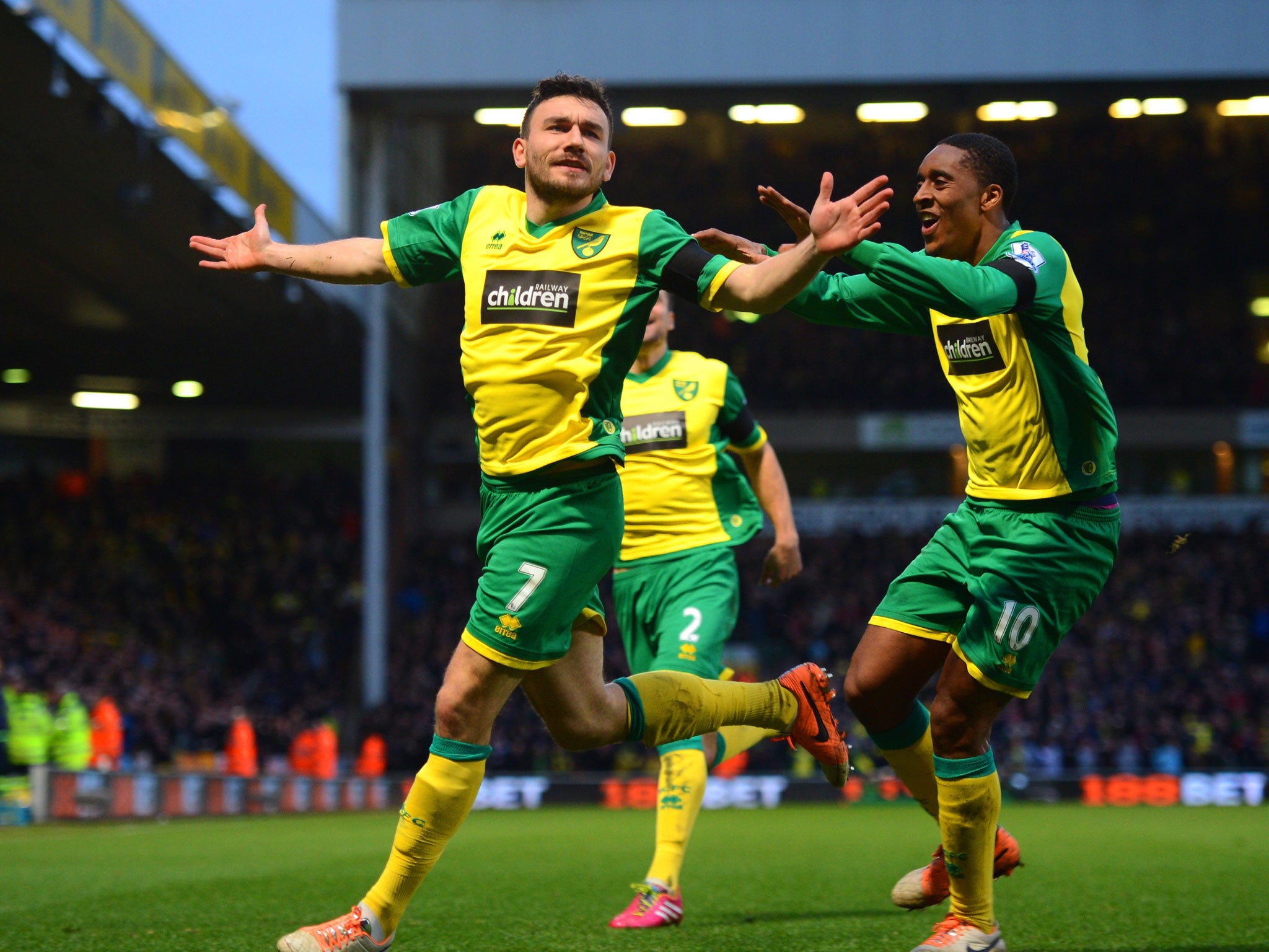 Robert Snodgrass (left) celebrates a winning goal for Norwichwith Leroy Fey