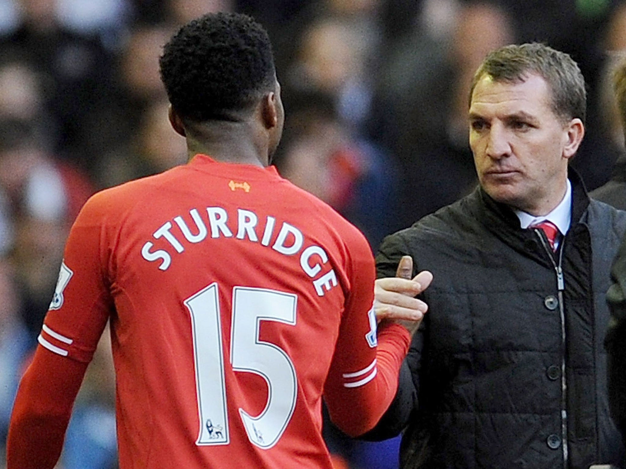 Liverpool manager Brendan Rodgers shakes the hand of striker Daniel Sturridge as he leaves the pitch