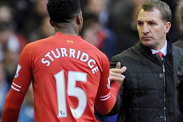 Liverpool manager Brendan Rodgers shakes the hand of striker Daniel Sturridge as he leaves the pitch
