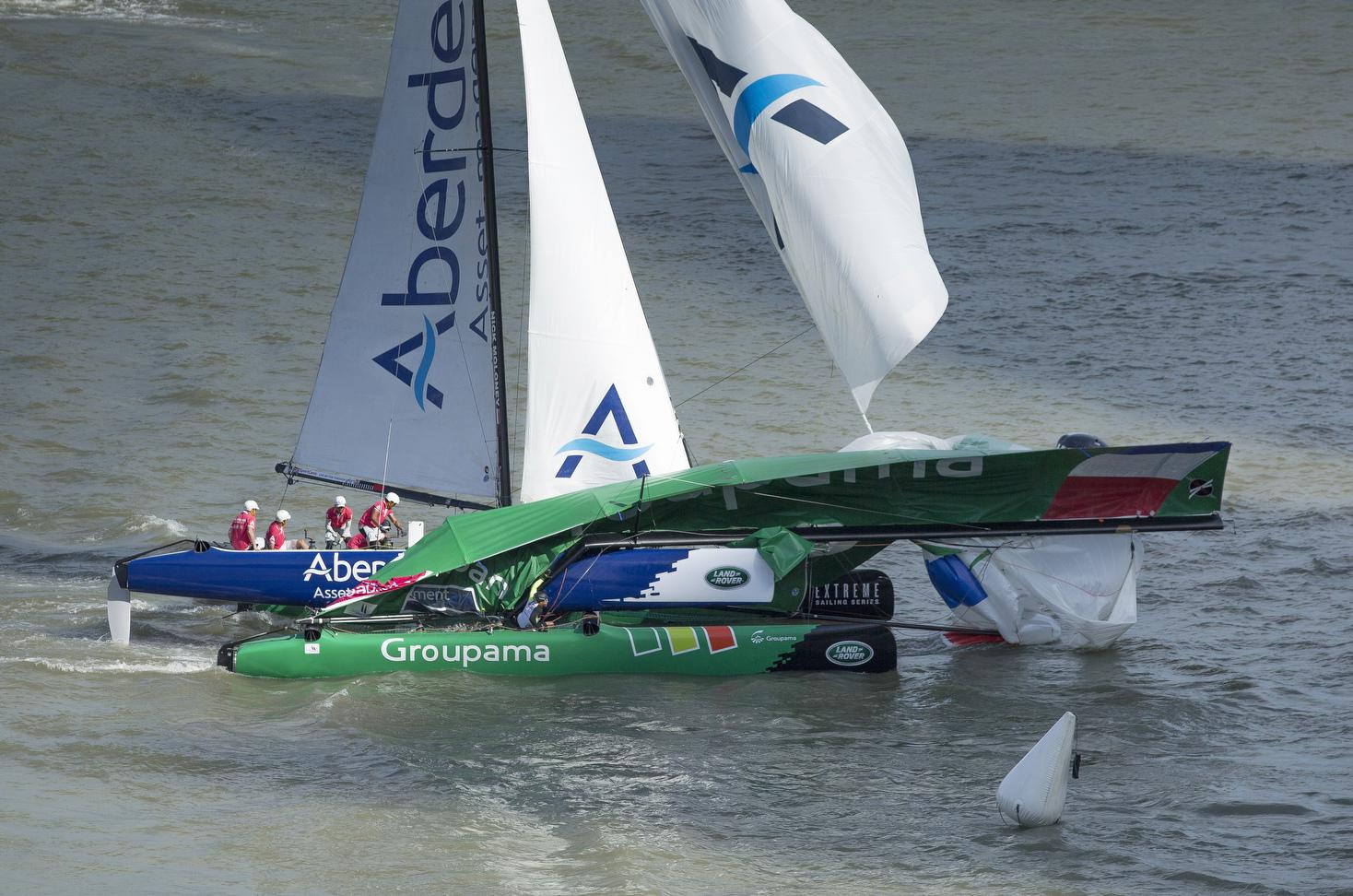 Serious crash but no serious injuries as Aberdeen Asset Management carves into potential French America’s Cup contender Franck Cammas’ Groupama in the opening 2014 Extreme Sailing Series regatta in Singapore