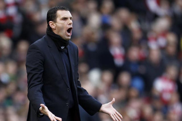 Gus Poyet makes a gesture from the sidelines