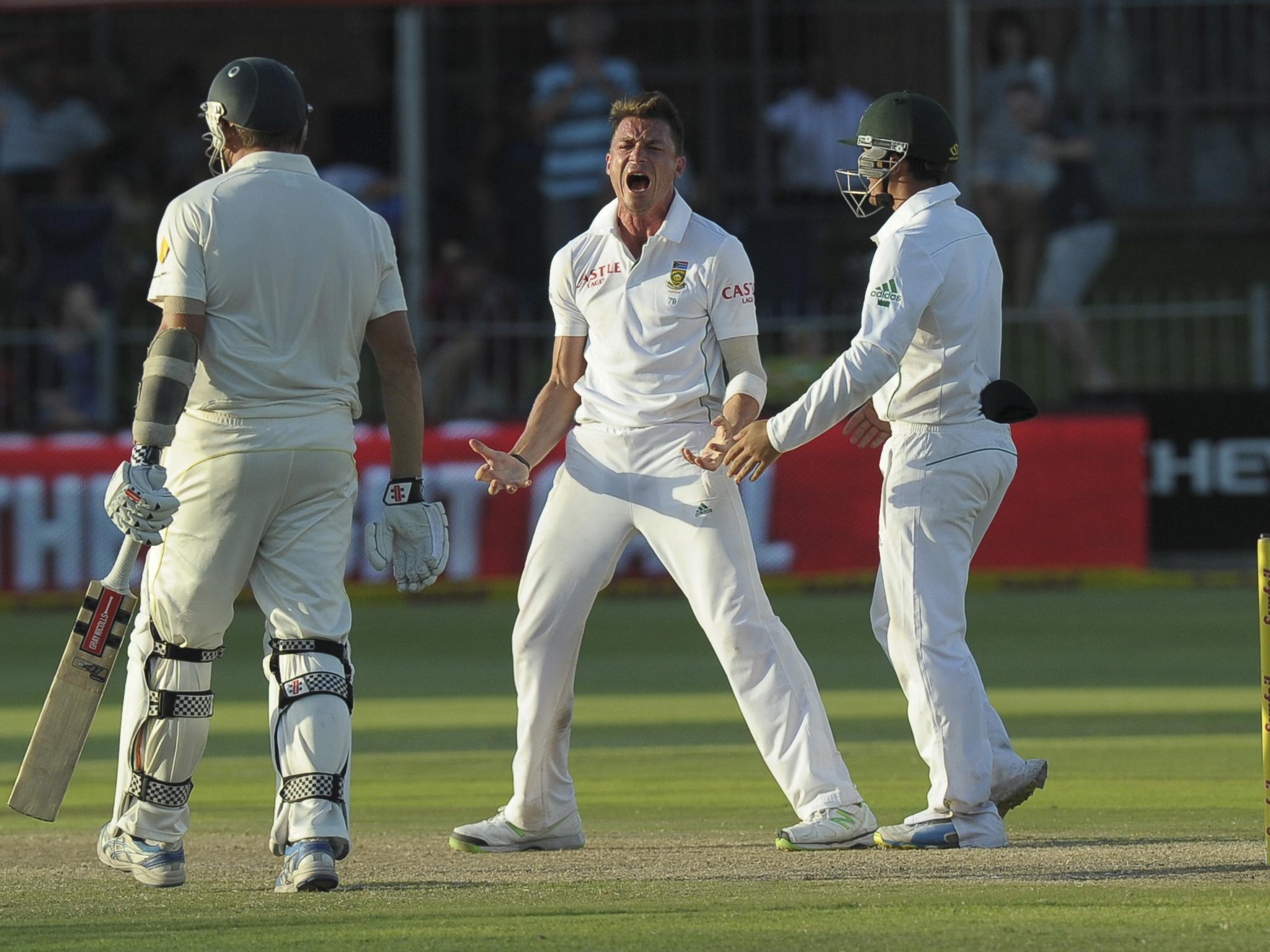 Dale Steyn (centre) celebrates taking the wicket of Ryan Harris in South Africa’s series-levelling second Test win over Australia yesterday