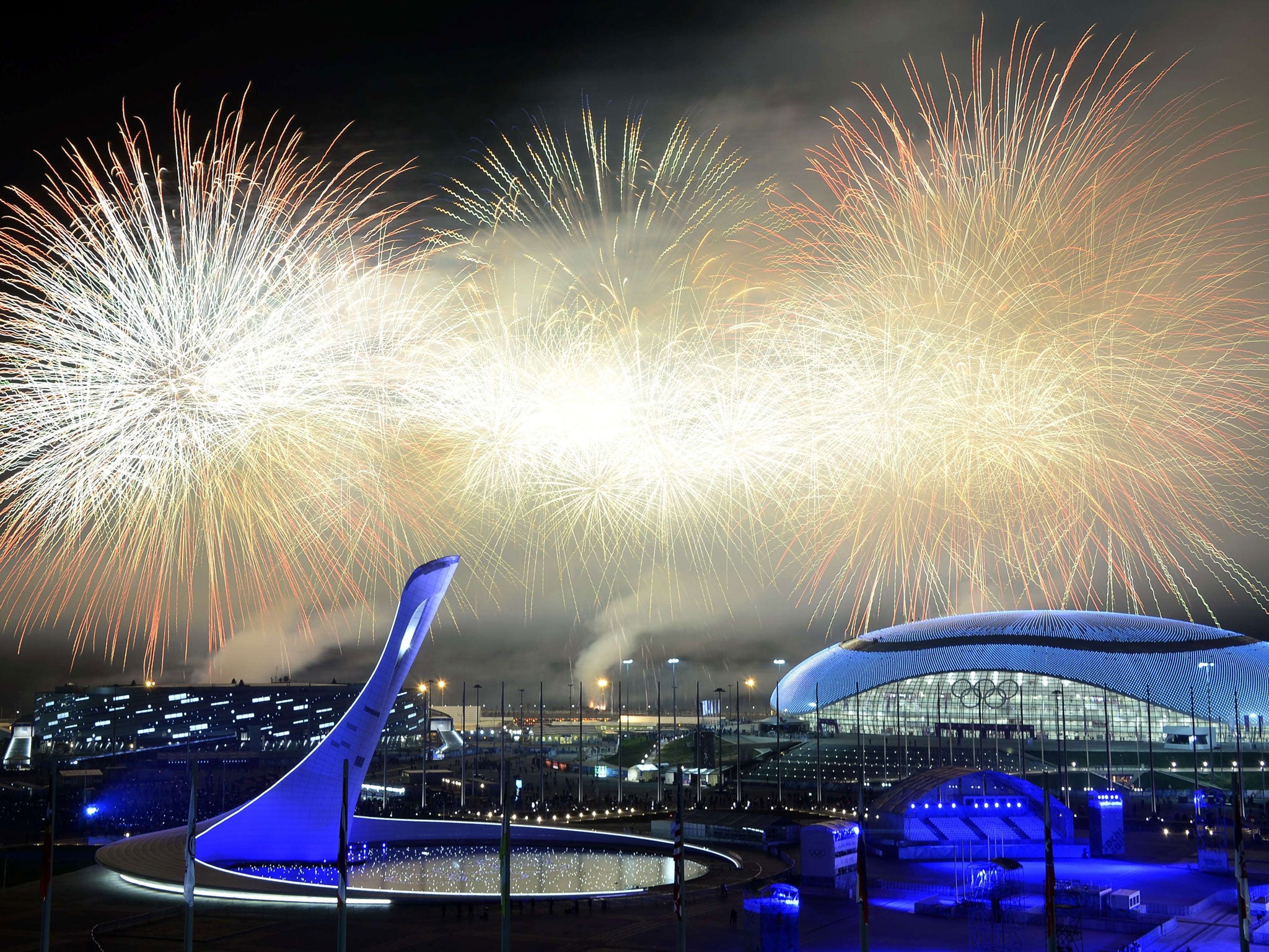 Fireworks explode around the Fisht Olympic Stadium at the end of the Closing Ceremony of the Sochi Winter Olympics at the Olympic Park in Sochi