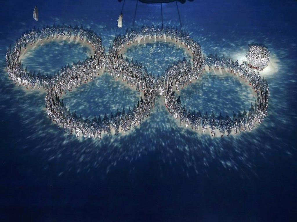 Hundreds of dancers join together to form the Olympics logo, with the fifth ring purposefully representing the malfunction in the opening ceremony