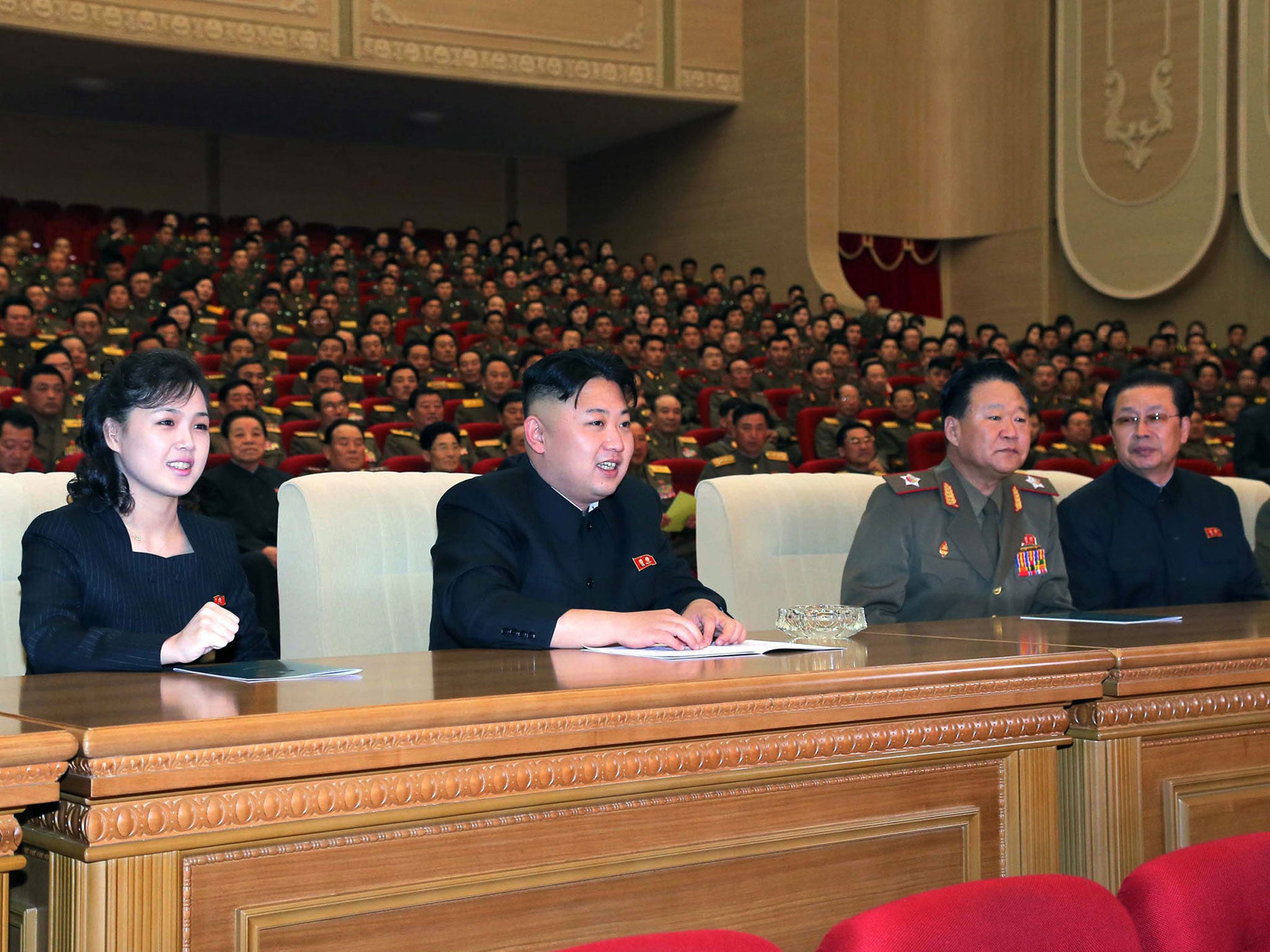 A photo released by North Korea's media in 2013 shows Kim Jong-un and his wife Ri Sol Ju.