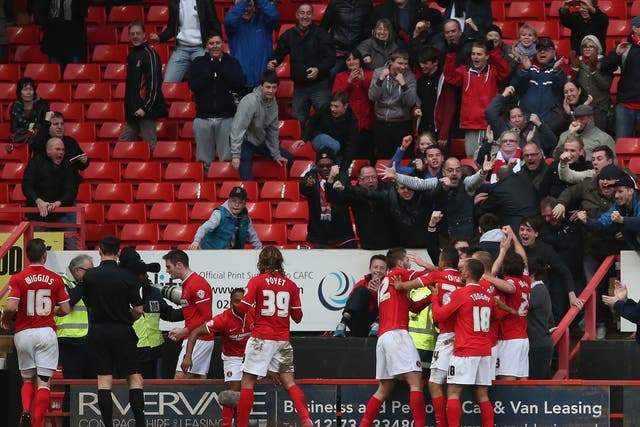 Charlton fans celebrate Johnnie Jackson's goal in the Championship clash with QPR