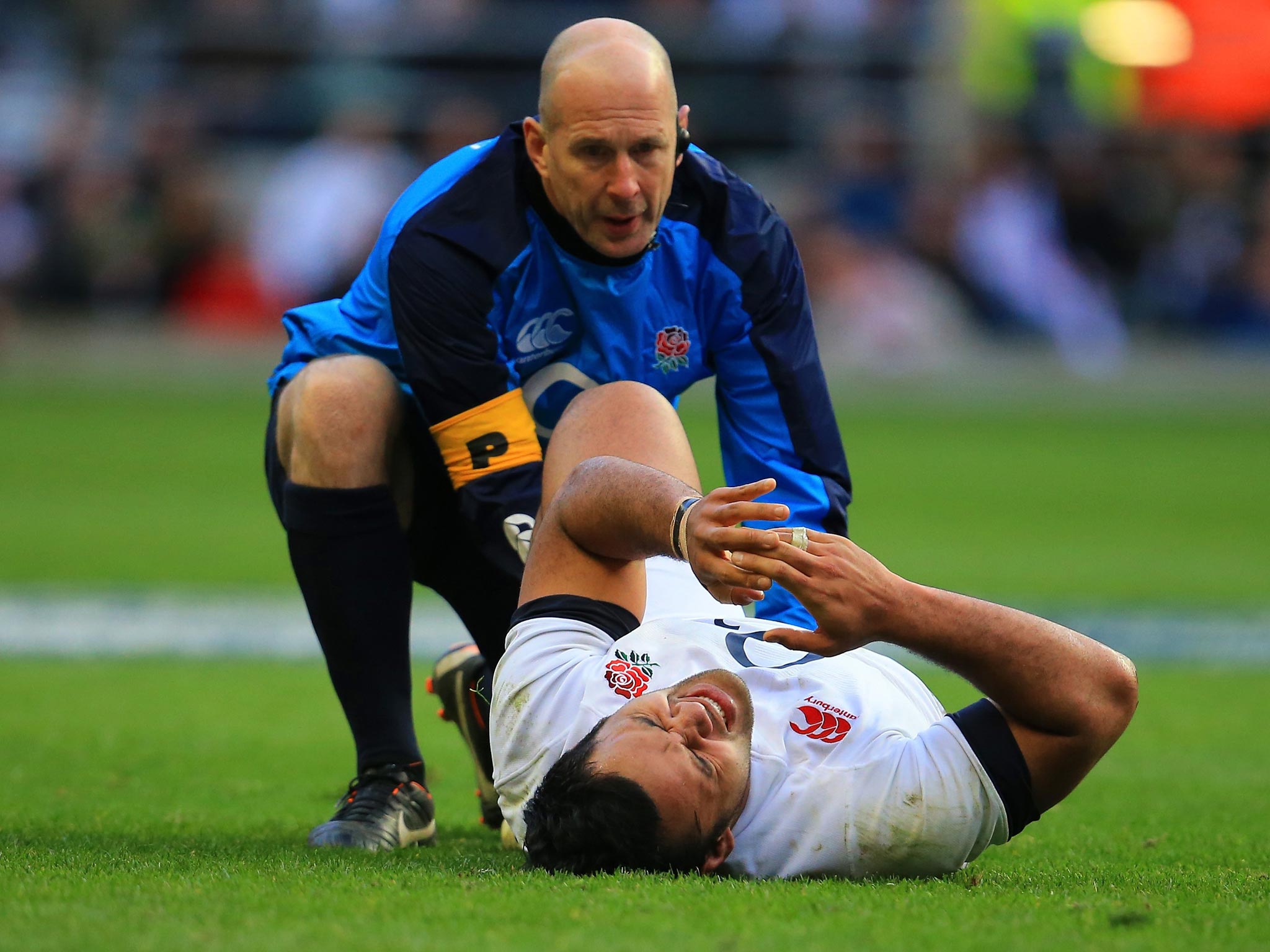 Billy Vunipola receives treatment on his injured ankle at Twickenham on Saturday (Getty Images)