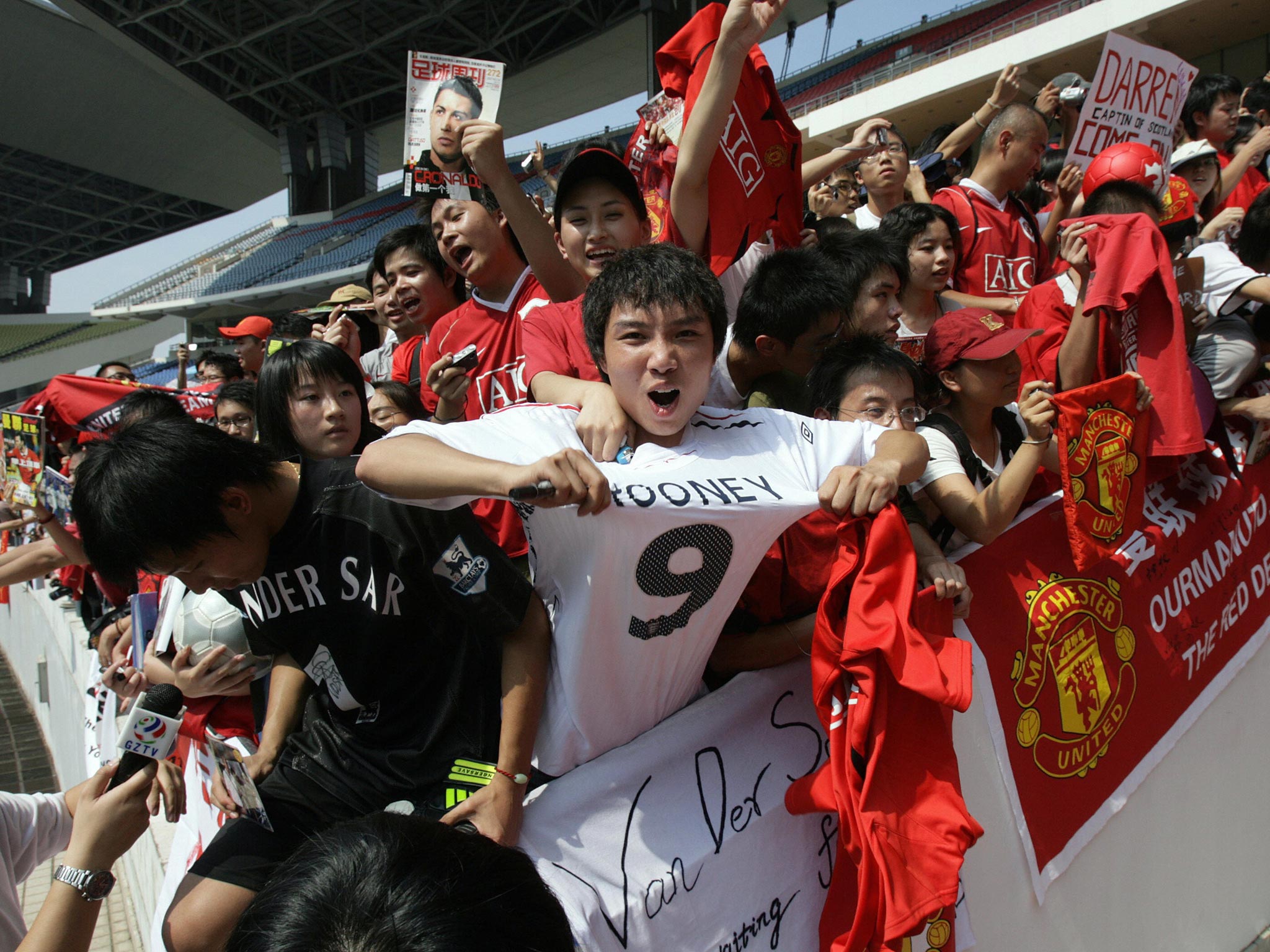 The Rooney brand extends to China, where fans sport the Manchester United player’s image