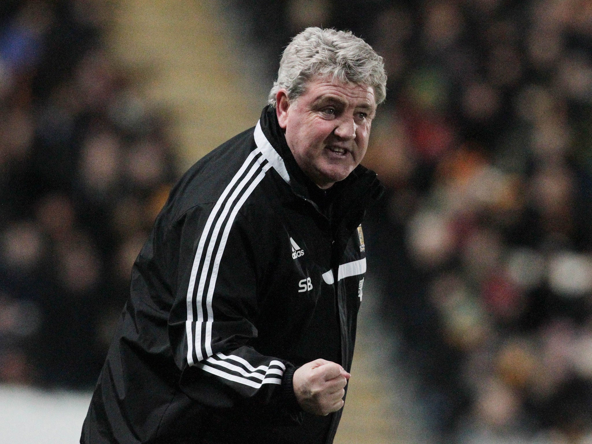 Steve Bruce makes a gesture form the touchline