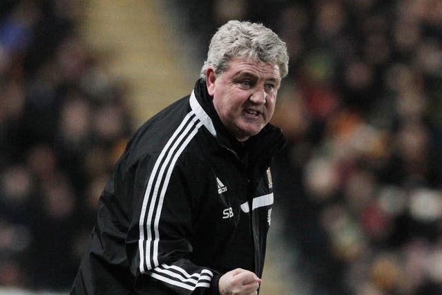 Steve Bruce makes a gesture form the touchline
