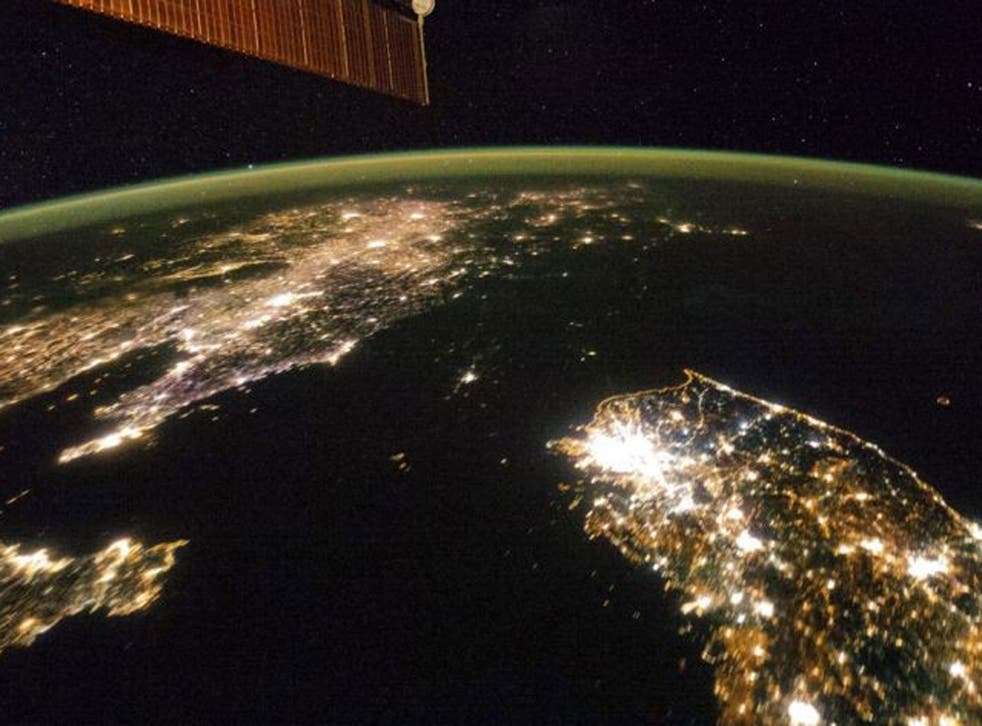 North Korea appears as a black expanse of sea between neighbouring China (left) and South Korea (right)