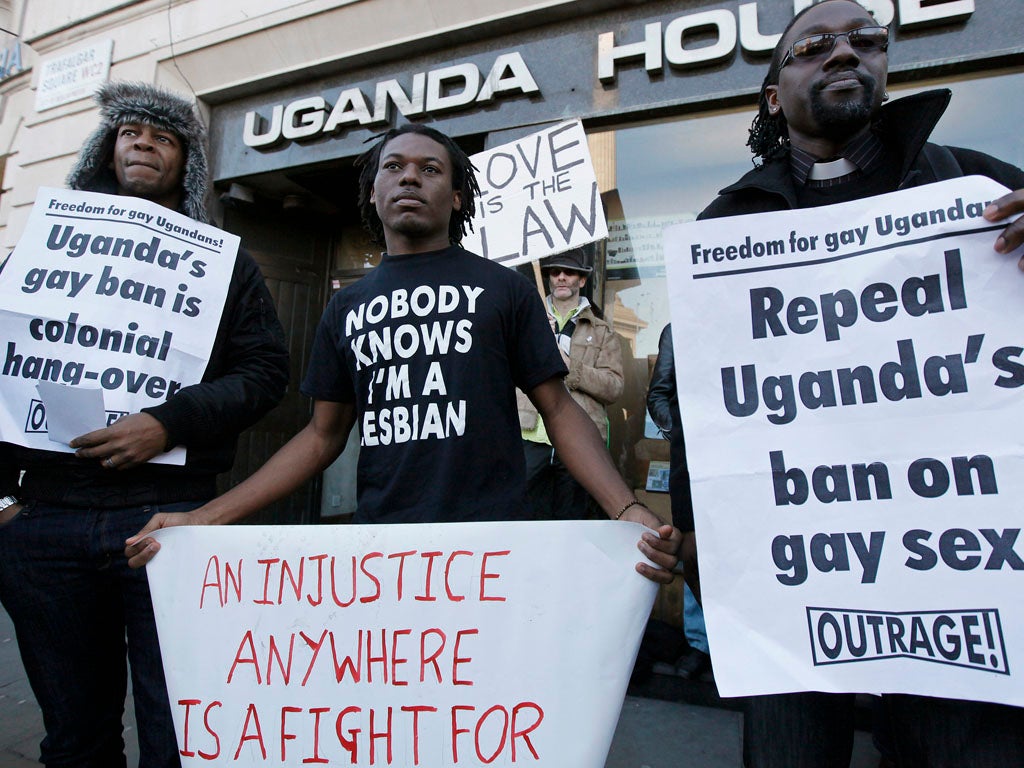 Demonstrators protest outside the Ugandan embassy, in central London, on December 10, 2009. Uganda proposed a law which would outlaw gay relationships and threaten homosexuals with the death penalty. The Anti-Homosexuality Bill has sparked outrage around