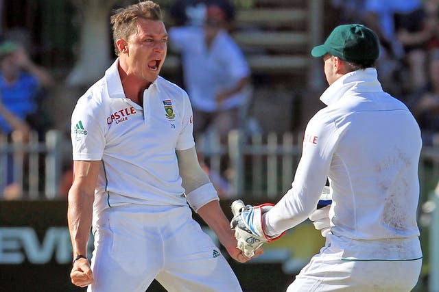 A B de Villiers (right) celebrates another wicket taken during Dale Steyn’s spell of reverse swing