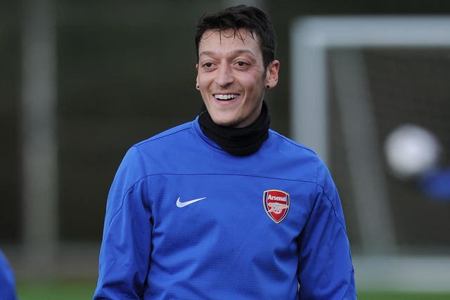 Mesut Ozil has been backed by his national coach Joachim Low to rediscover his best form ahead of the 2014 World Cup