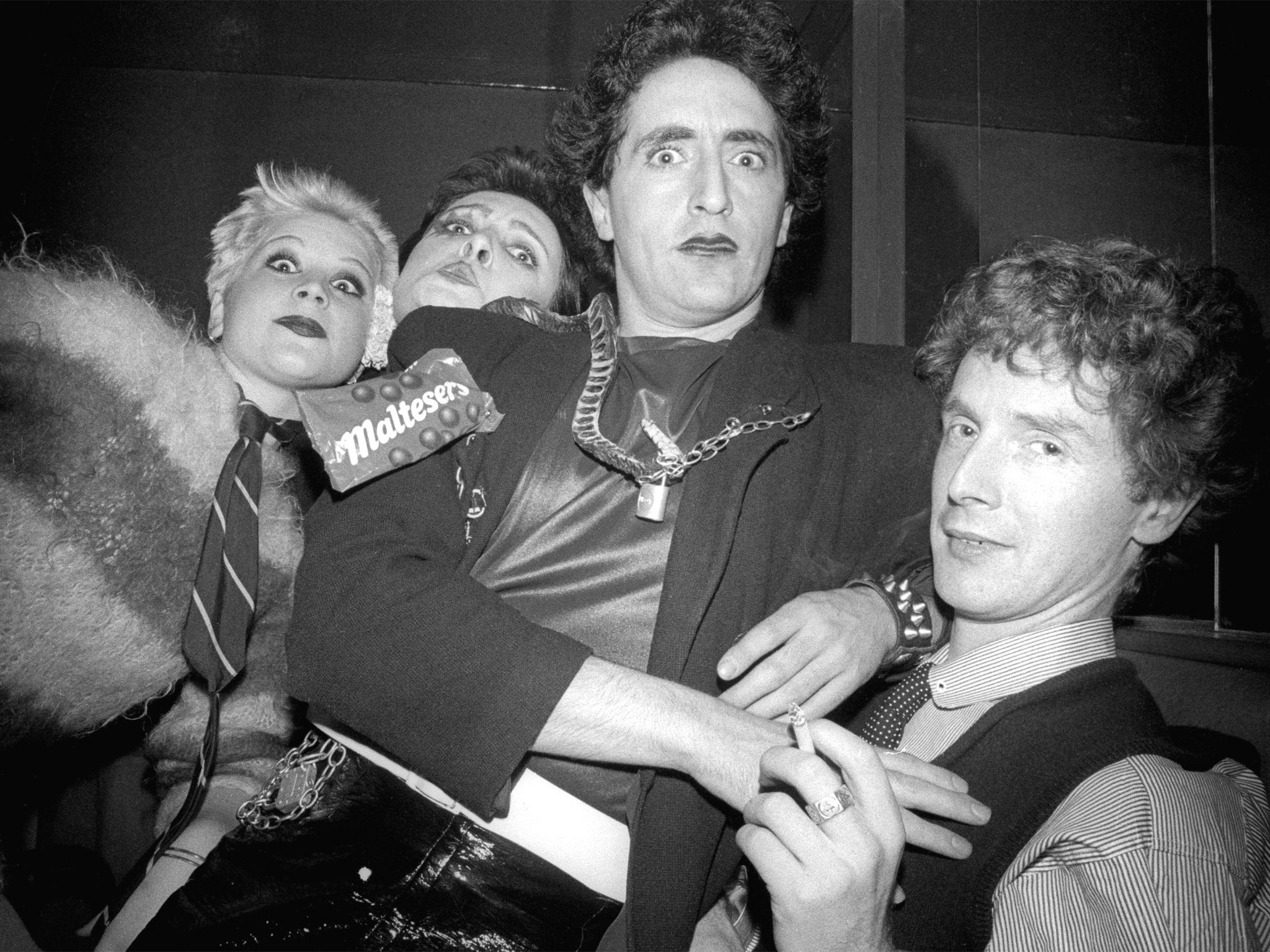 Malcolm McLaren (right) with Pistols fans including Siouxsie Sioux (second left) in 1976